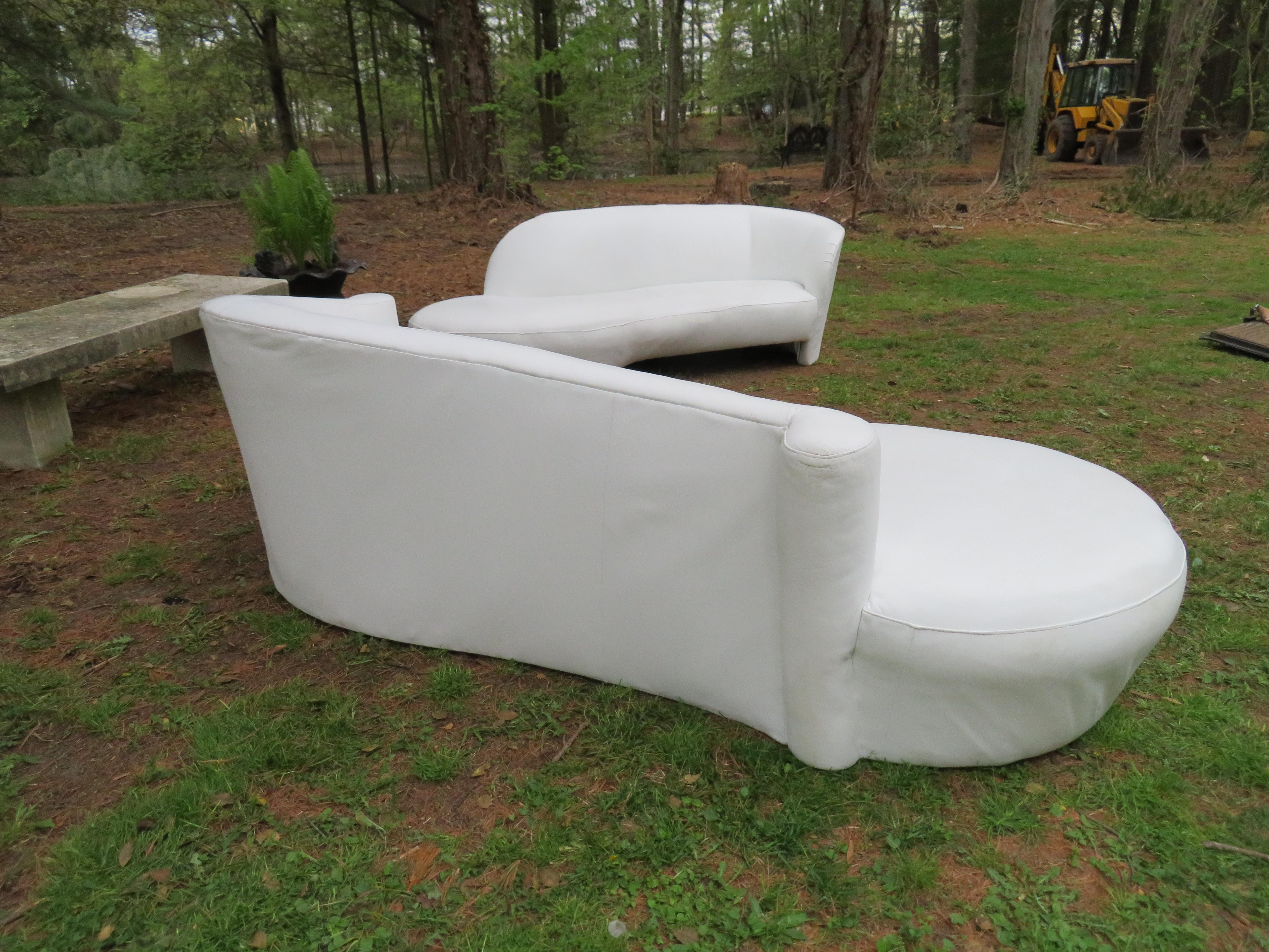 Fabulous Vladimir Kagan scrolled arm white leather cloud sofa, circa 1980's. This sofa has been recently re-upholstered in a durable thick white leather and looks great. Check out the coordinating Kagan white leather sofa that we also have-they look