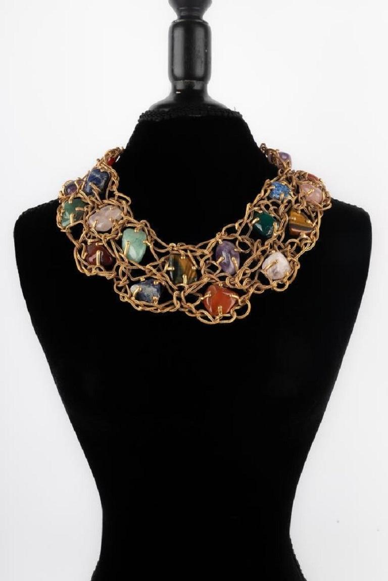 Yves Saint Laurent - (Made in France) Necklace in braided gold metal mesh holding cabochons in hard stones such as quartz, tiger's eye, amethyst or jadeite. Probably Spring-Summer 1988 collection. Work of the Goossens workshop for the house of Yves
