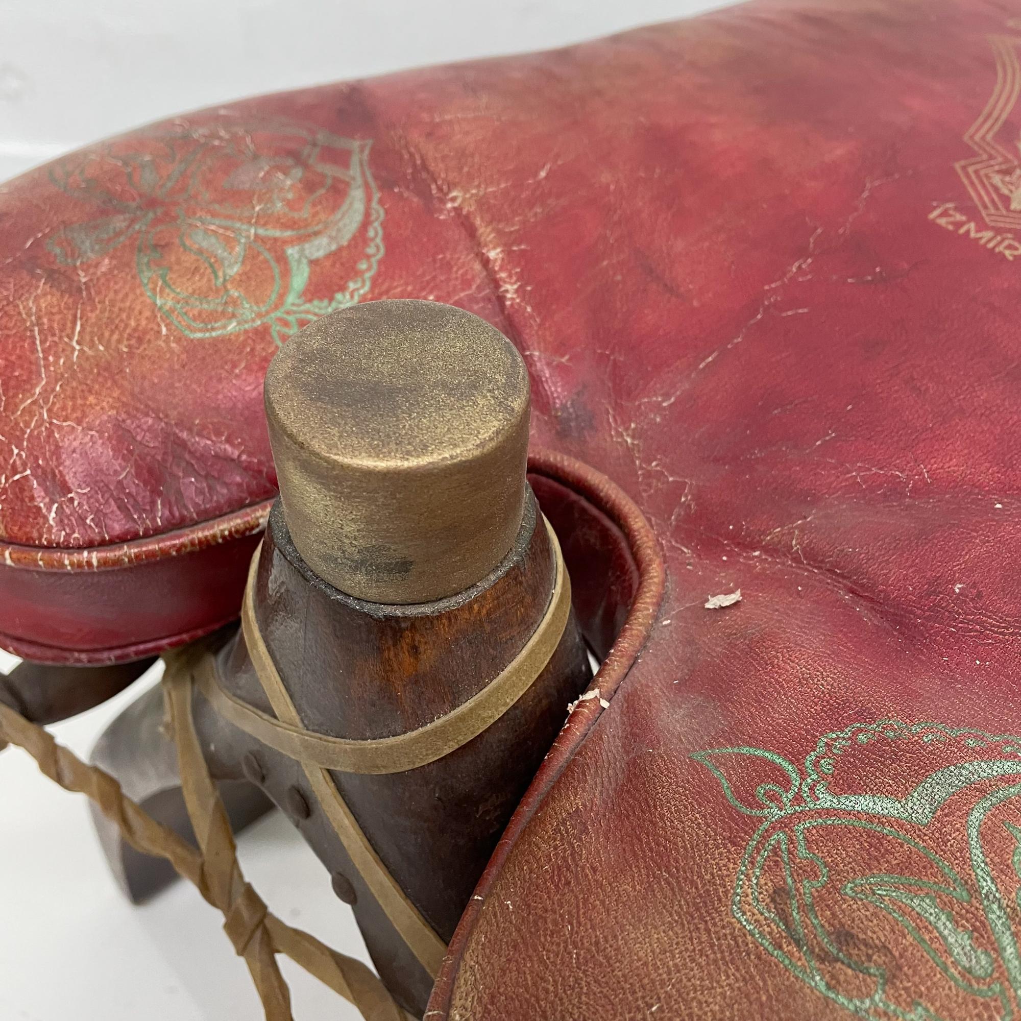 Red Foot Stool
Fabulously Distressed Vintage IZMIR camel Ottoman Foot Stool in Wood Goatskin & Metal with distressed Red Leather Cushion. Includes lovely graphics on leather. Stamped Izmir.
Measures: 13 H x 26 W x 14 D inches
Please review all of