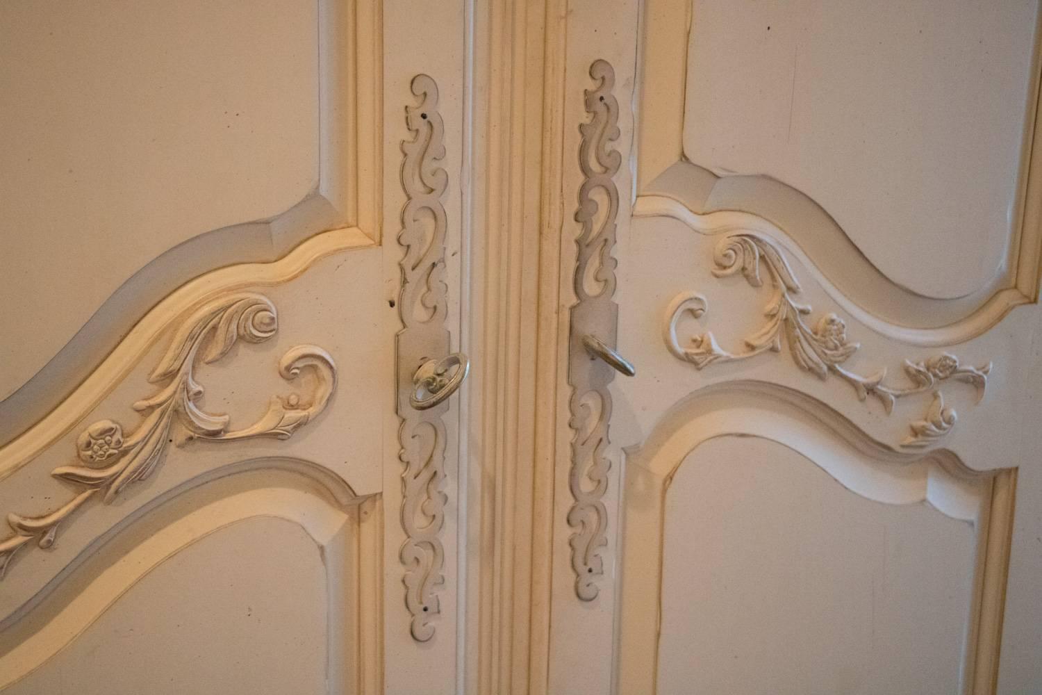 ON SALE NOW!!  Fabulously French armoire carved detail French creme white painted tons of space. Pretty French distressed armoire great detail creme white. One drawer on bottom loads of storage. Shelf on inside top. Drawers and key. Delicate
