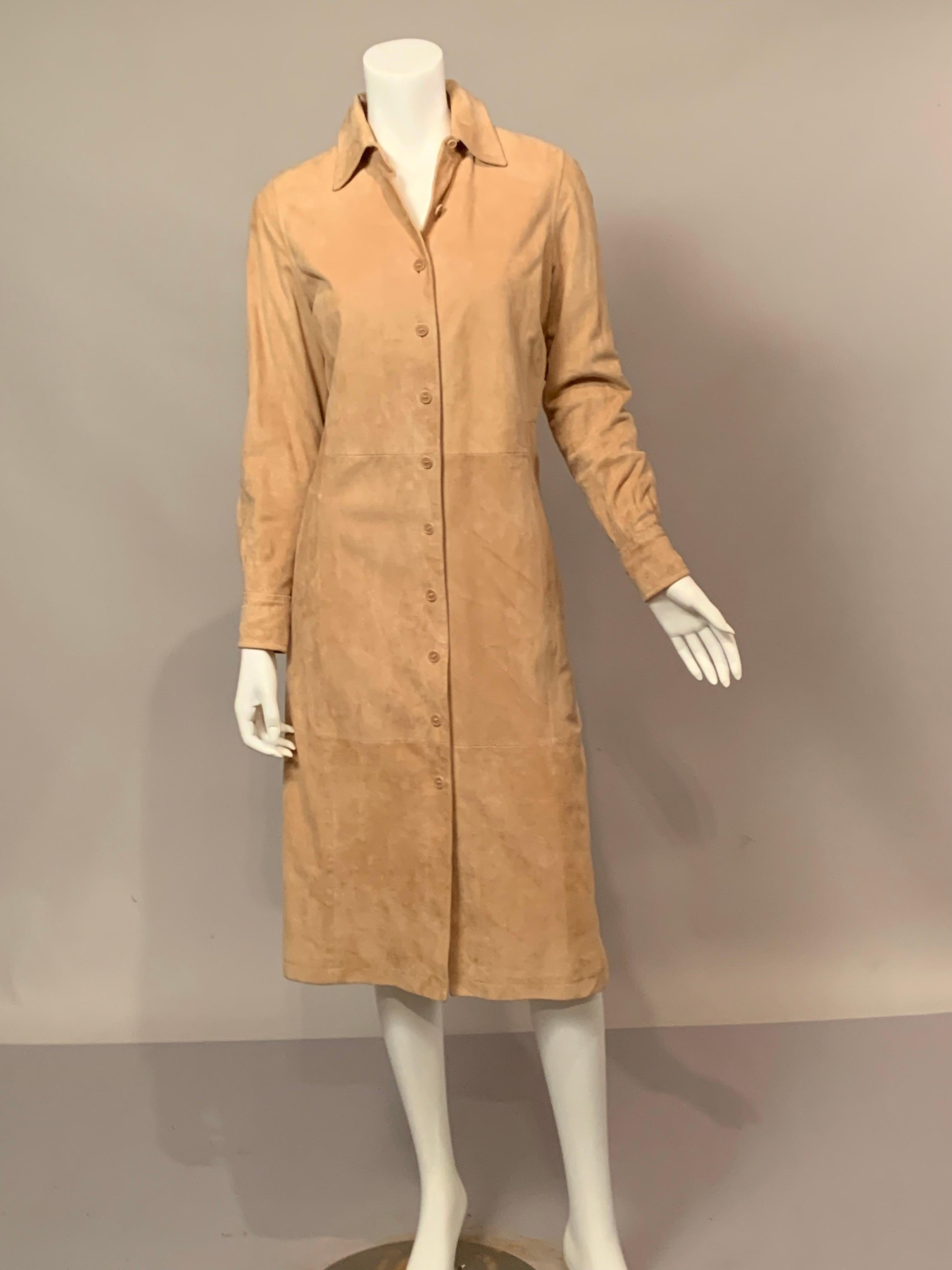 This Facconable, Paris light tan button front suede dress or coat dress can be dressed up or down for so many occasions.  It has a button front, with a small label near the hem, side openings in the skirt, and button cuffs which also look good