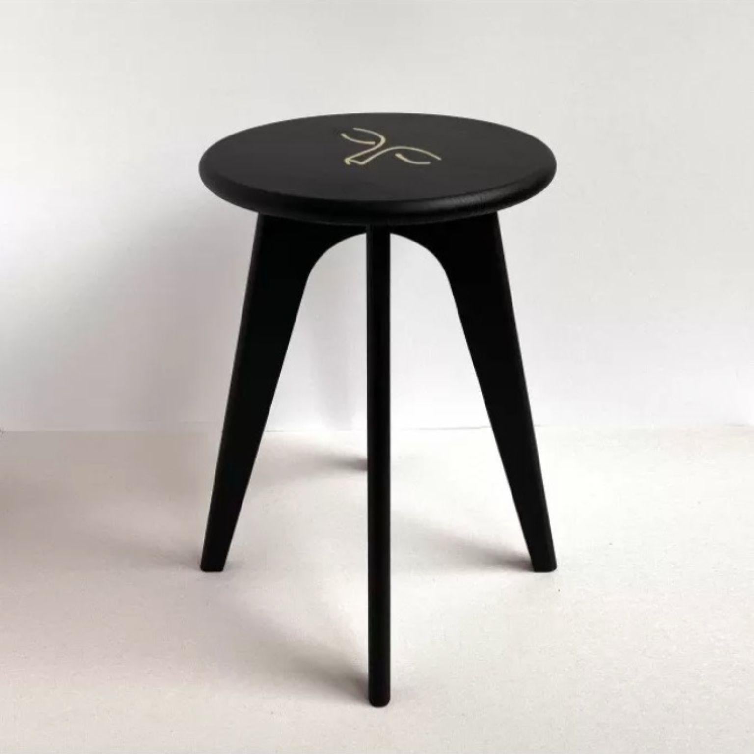 Face Design Black Stained Ash ASSY Stool by Mademoiselle Jo
Dimensions: Ø 35 x H 43 cm.
Materials: Ash wood and brass inlay.

Available in two wood colors and several designs.  Please contact us.

At the border between design and goldsmithing, the