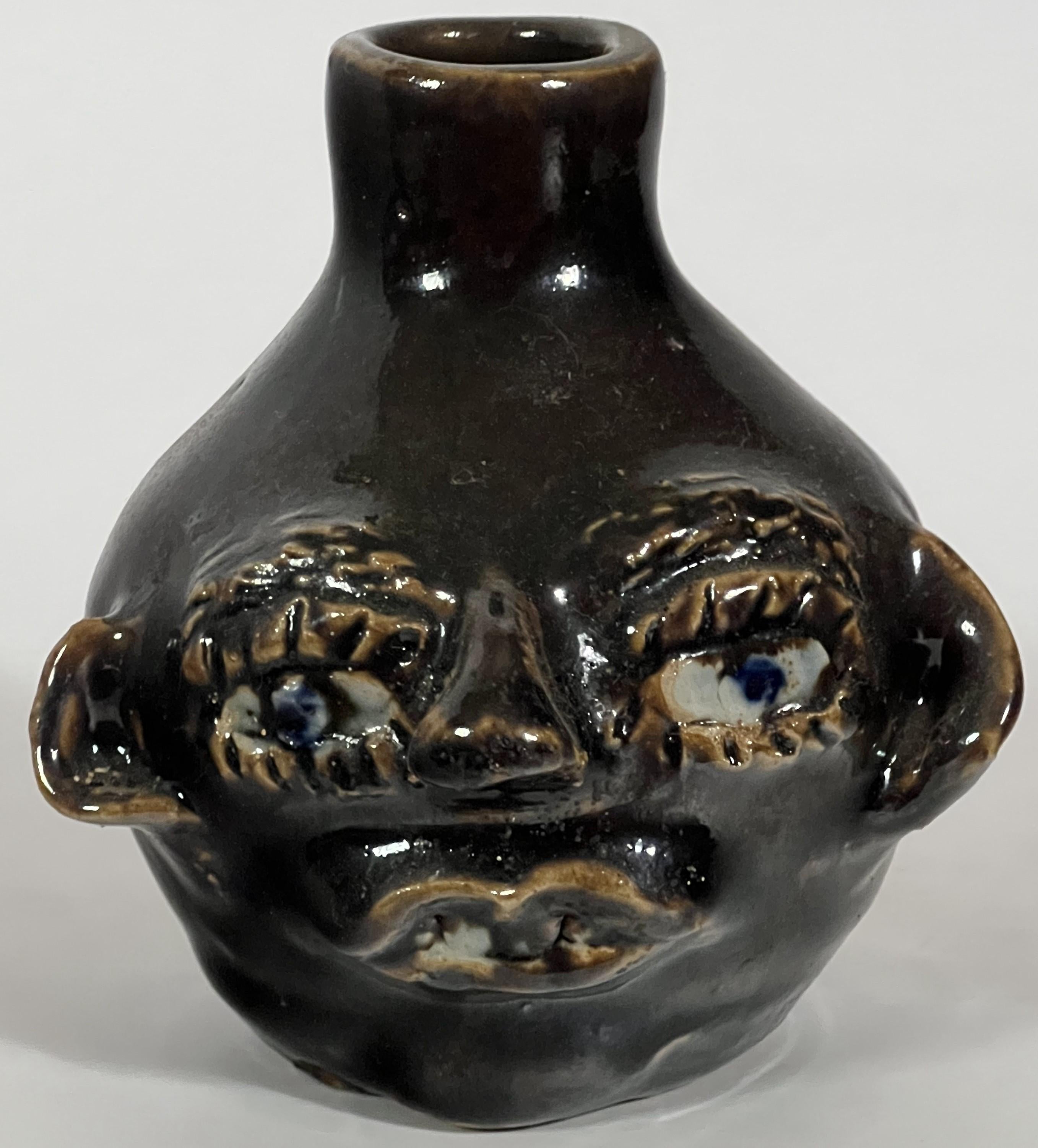 The Face Jug tradition in the Southern United States is the best known vernacular style and dates to the early 19th century.  The revival of the traditional Southern Pottery dates to the 1960's and was heavily driven by support from the Smithsonian