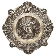 Face of Christ in full figure with reliefs and engravings