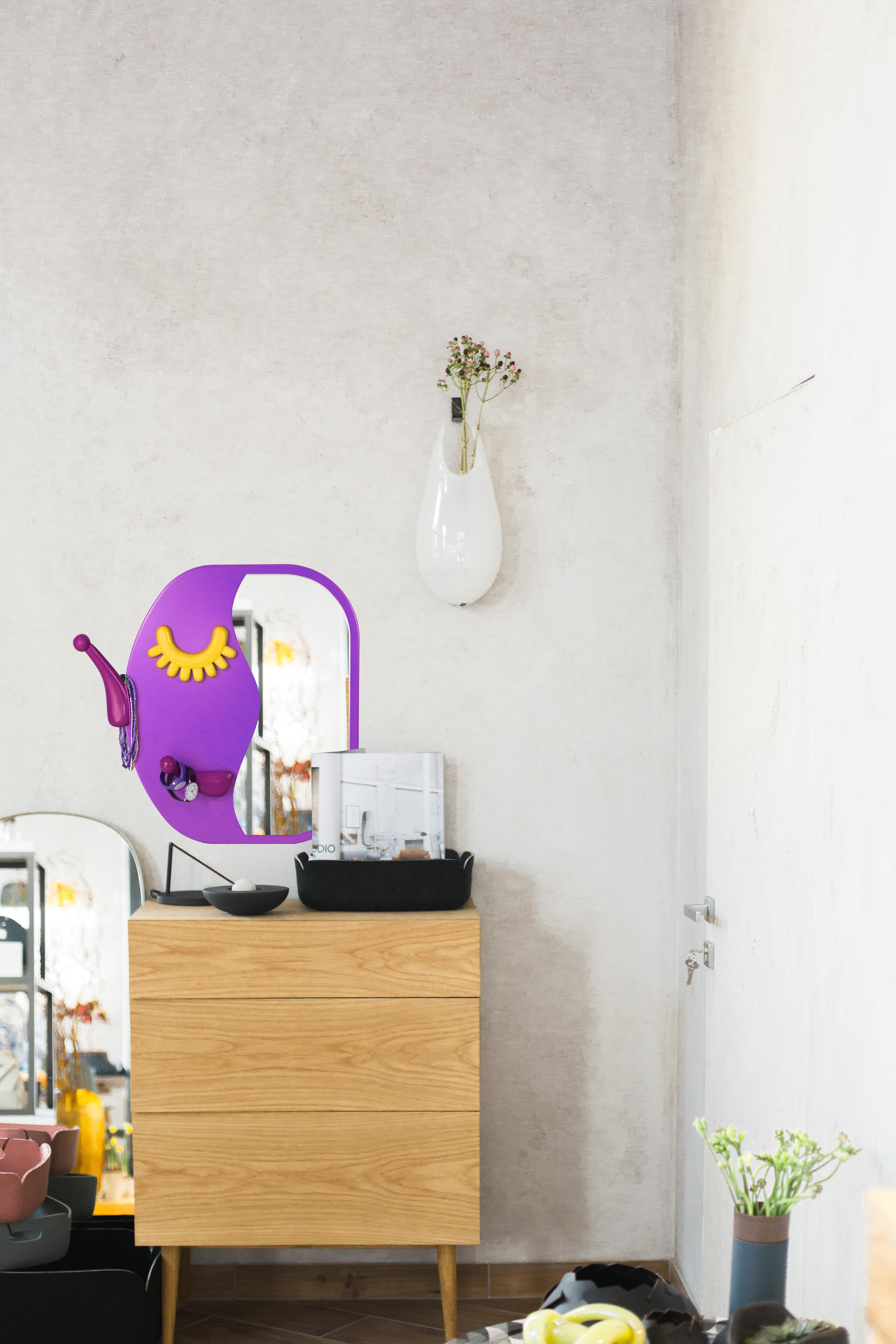 Overview:
Brighten up your daily routine with the Face to Face S Wall Mirror, a delightful combination of functionality and whimsical design. This piece not only offers a full-length reflection but also includes a hanger for convenient dressing, all