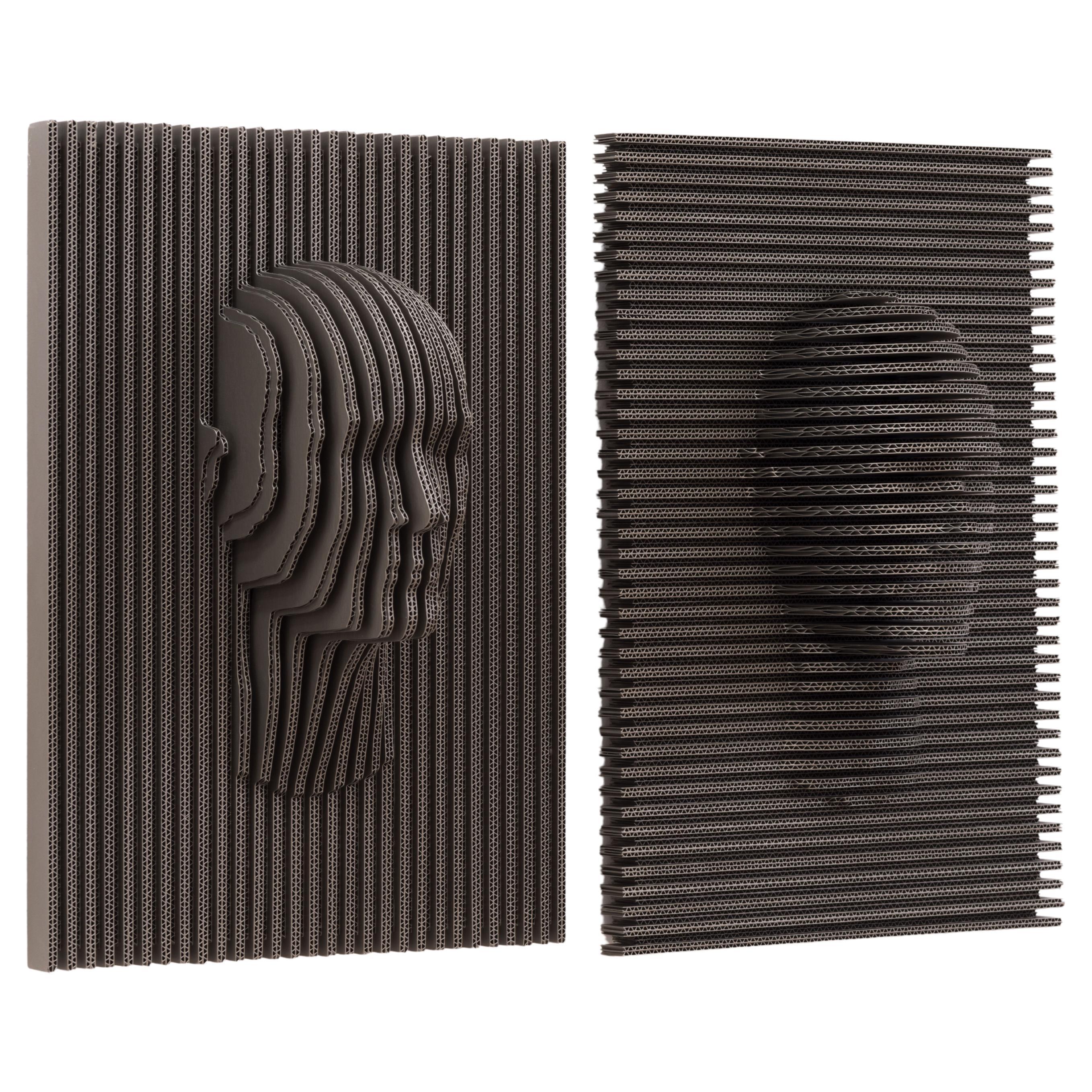 Conjunto Caras de Piegatto, una escultura contemporánea de pared