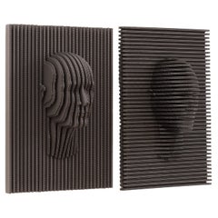 Conjunto Caras de Piegatto, una escultura contemporánea de pared