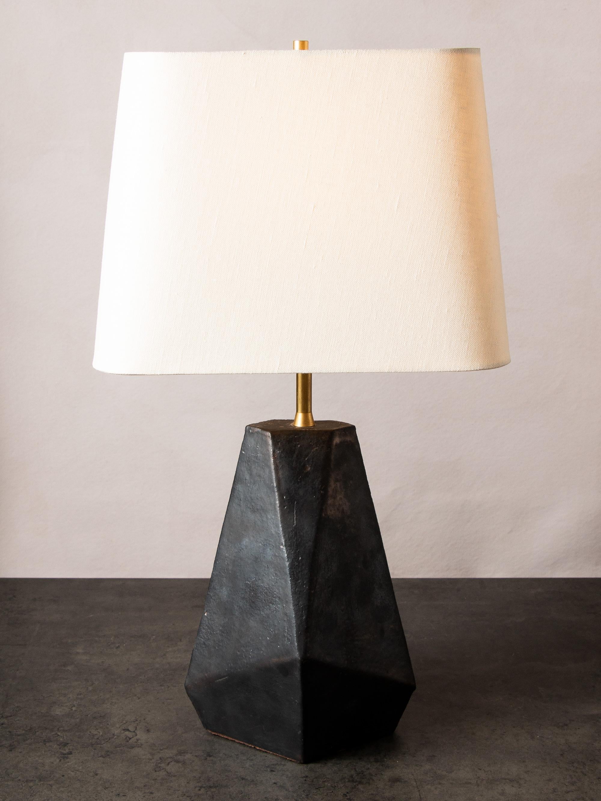 Inspired by midcentury Brutalist architecture, this tapered ceramic table lamp base combines clean geometric lines with the warmth and individuality inherent in handmade work. Each piece is assembled individually from flat sheets of clay, into a