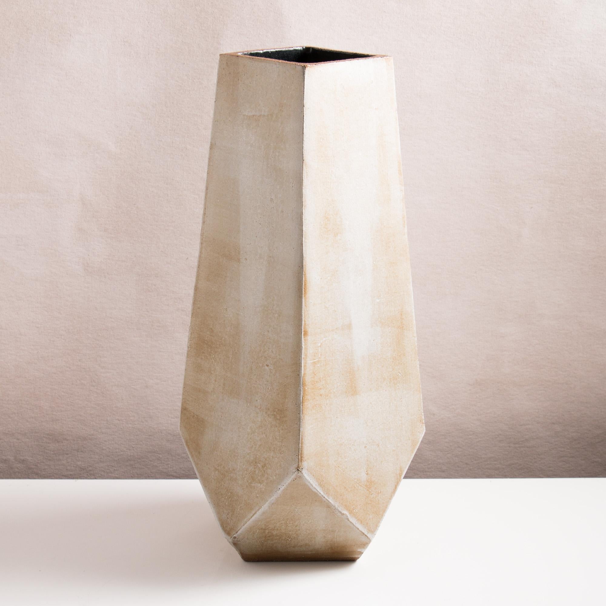 Inspired by midcentury Brutalist architecture, this massive ceramic vase combines clean geometric lines with the warmth and individuality inherent in handmade work. Perfect as a floor vase for branches or grasses, or as a dramatic table centrepiece.