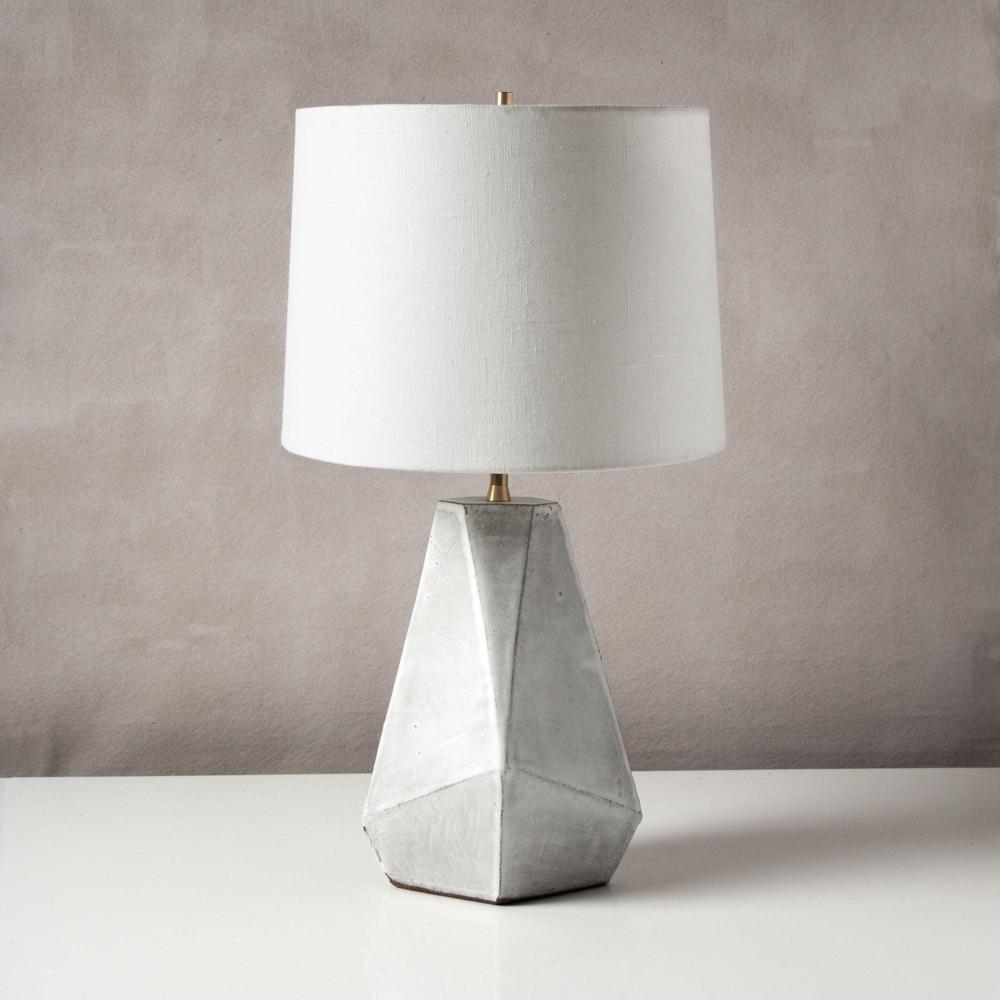 Inspired by midcentury Brutalist architecture, this tapered ceramic table lamp base combines clean geometric lines with the warmth and individuality inherent in handmade work. Each piece is assembled individually from flat sheets of clay, into a