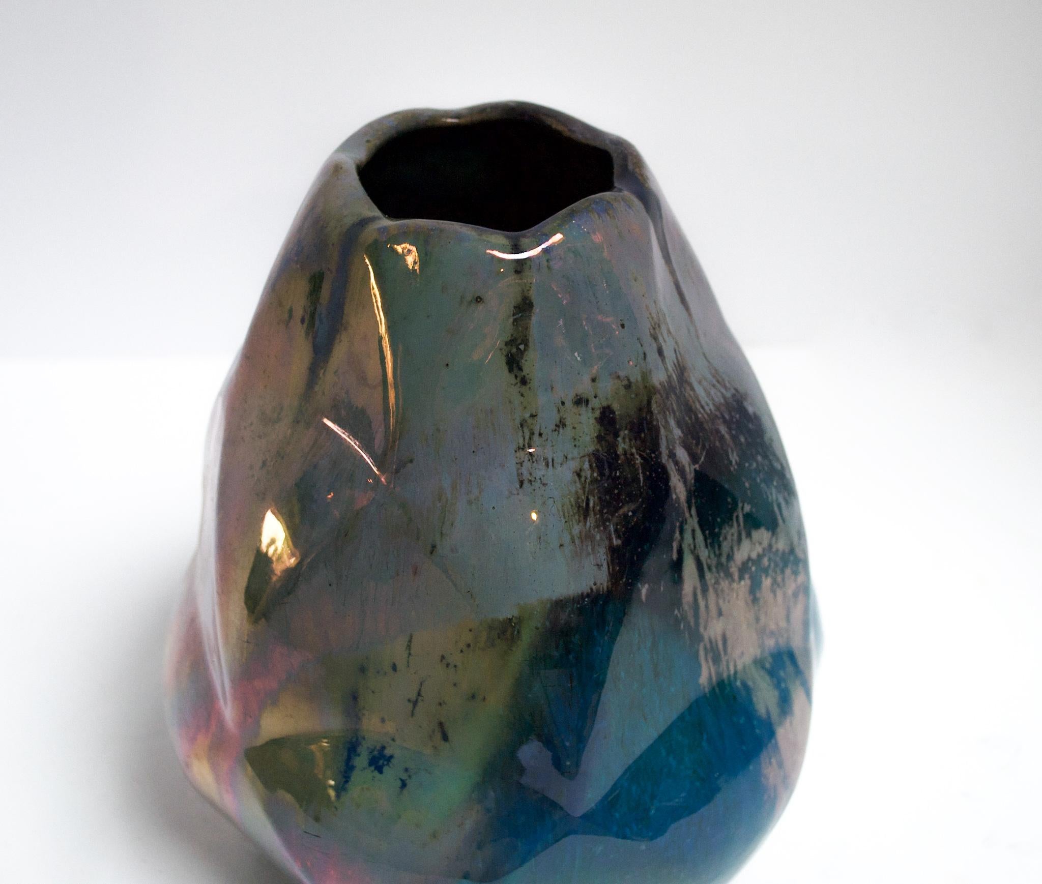 Alphonse Cytere took the world by storm in 1903 when he opened his studio in Rambervillers, France. It was here near the artistic center of Nancy that Cytere began creating ceramics with unique metallic, iridescent glazes. This beautifully crafted