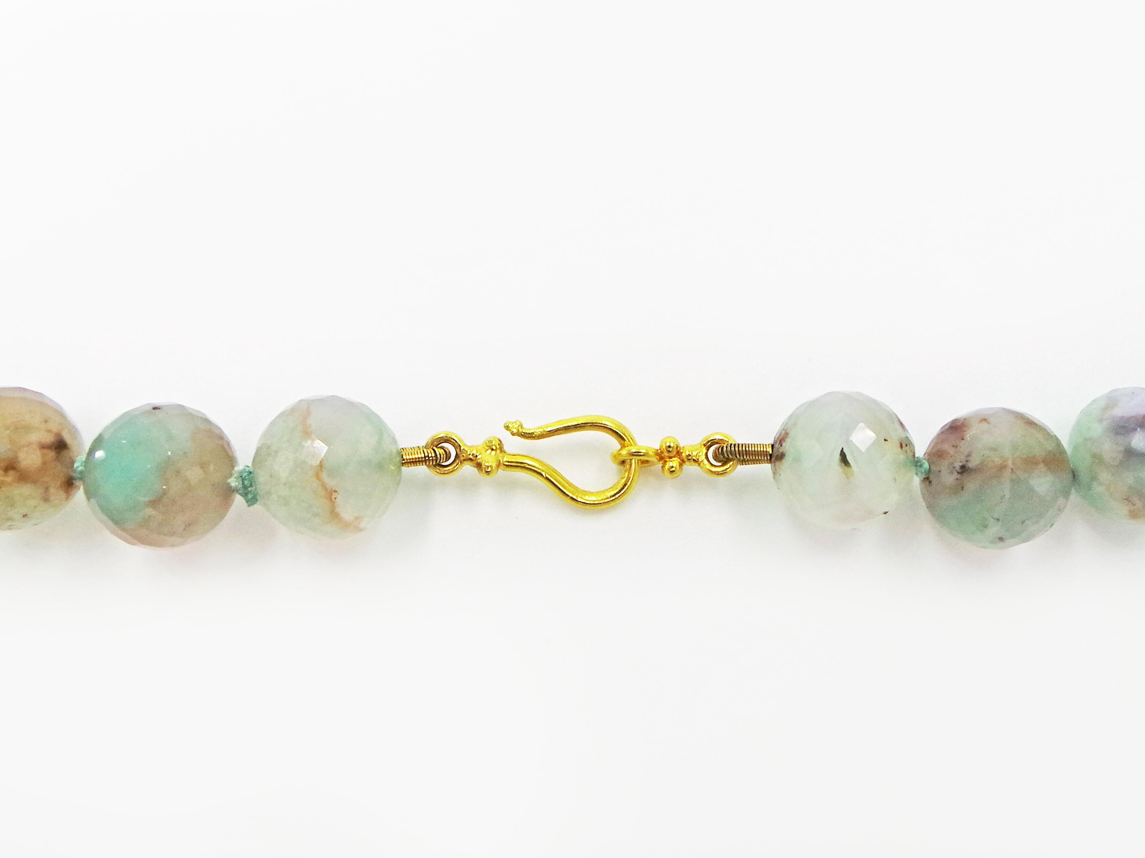 Beautiful and unique necklace featuring faceted Aquaprase beads hand-strung and finished with a 22k yellow gold toggle clasp. Aquaprase is one of the most recently discovered gemstones, being unearthed in 2014 by a gem explorer in Africa. Its