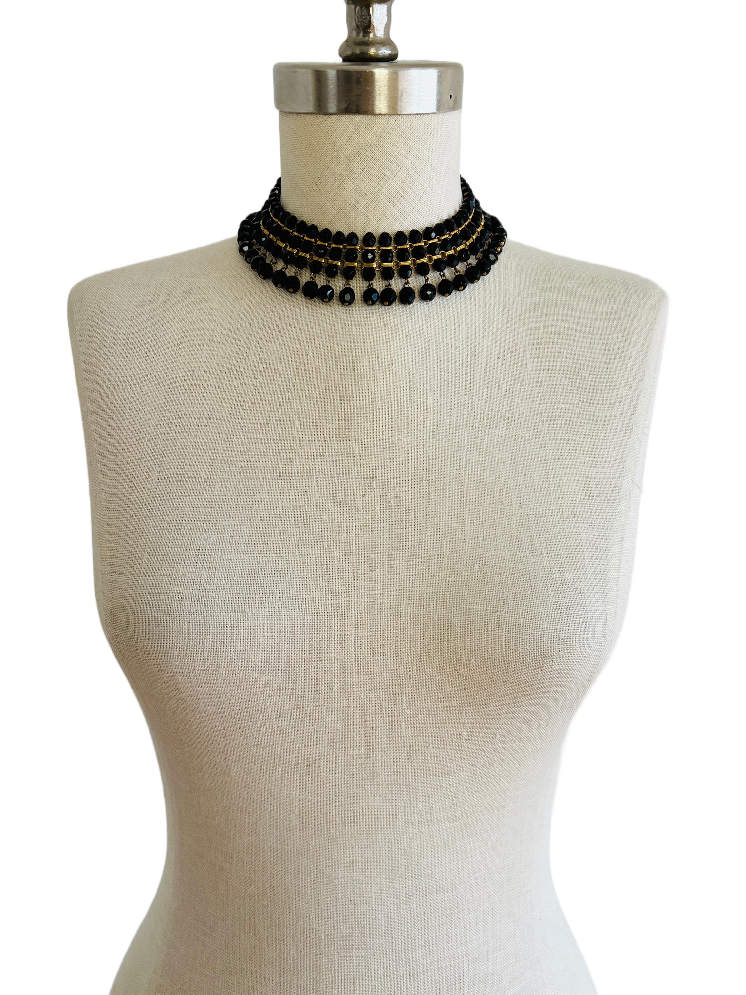 This elegant black choker necklace is well-constructed and layers nicely on the neck.

Size: 16.5