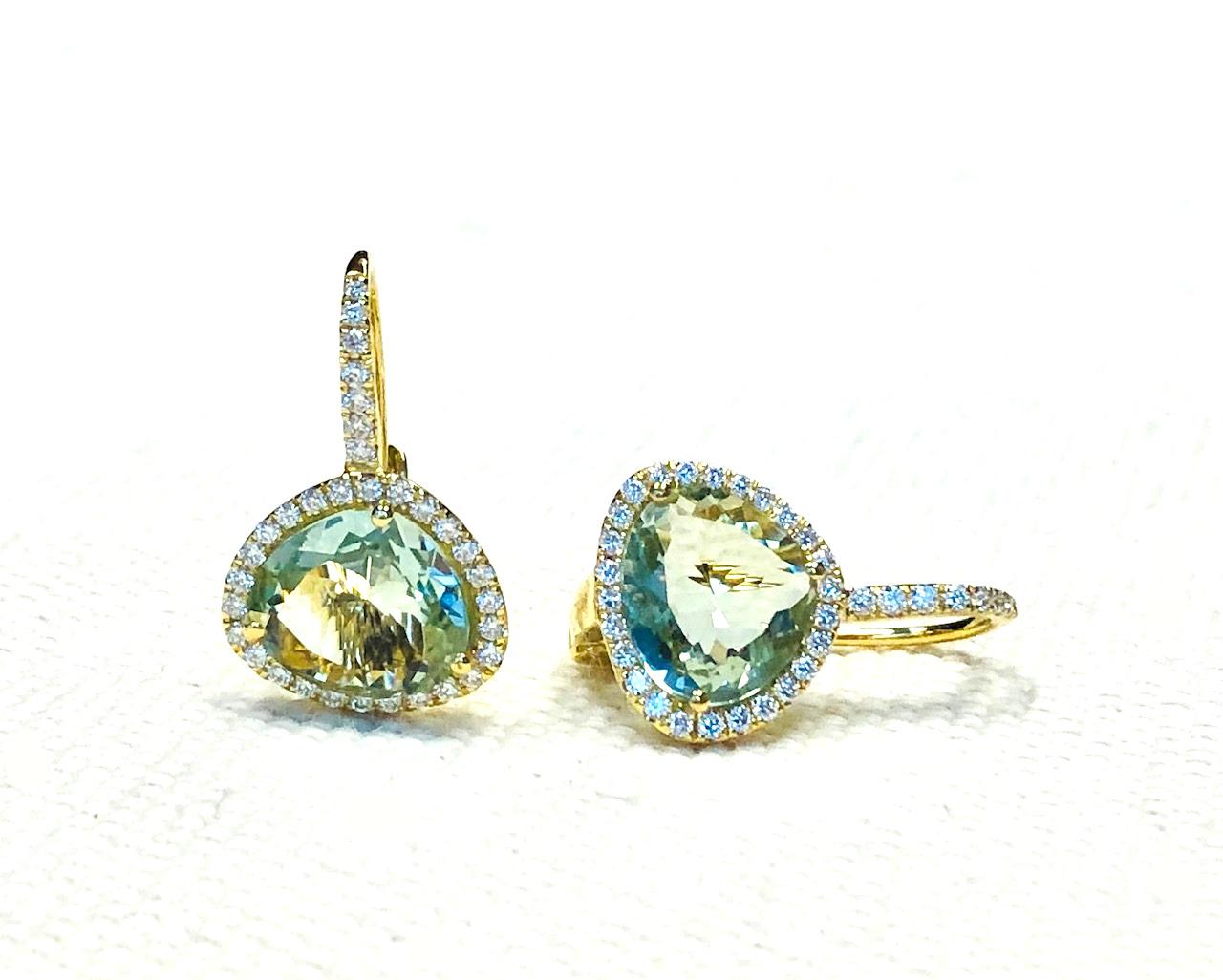 These stylish drop earrings feature crystal clear blue topaz 