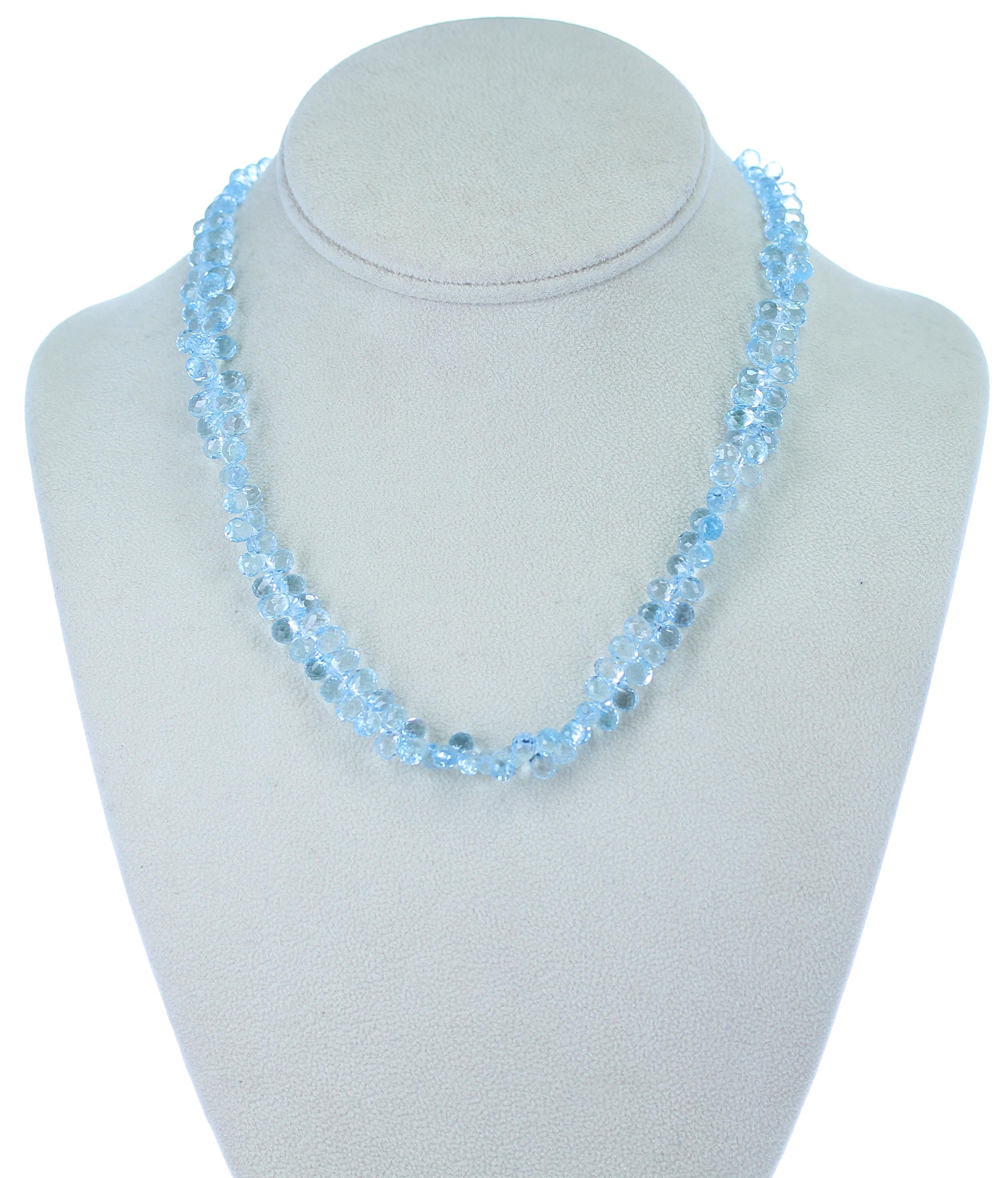 A beautiful Faceted Blue Topaz Briolette Drop Necklace weighing 200 carats. Length: 17.25 inches, 14K White Gold Clasp.