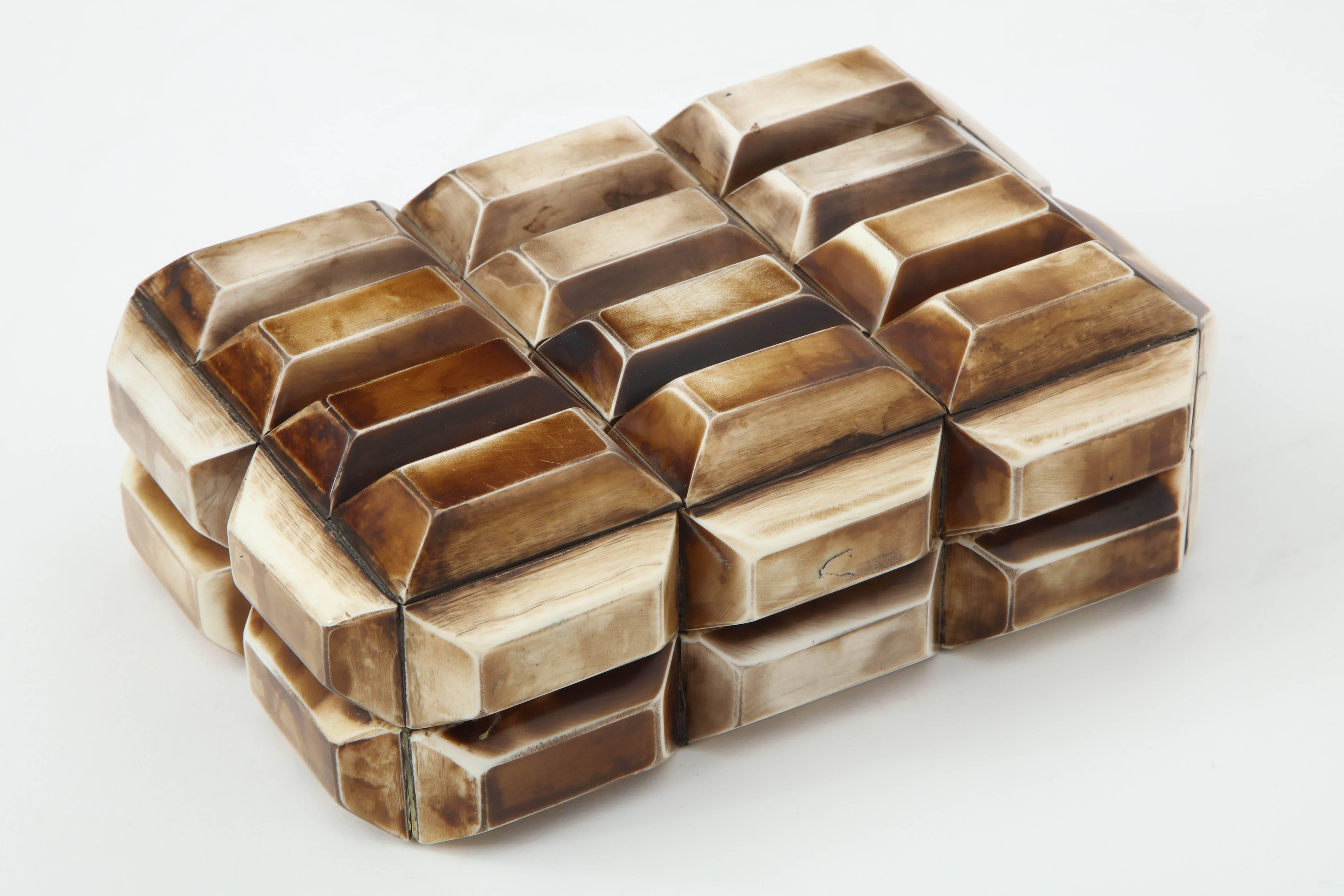 Modernist keepsake box composed of heat pressed faceted bone segments with an aged finish, lined in wood.