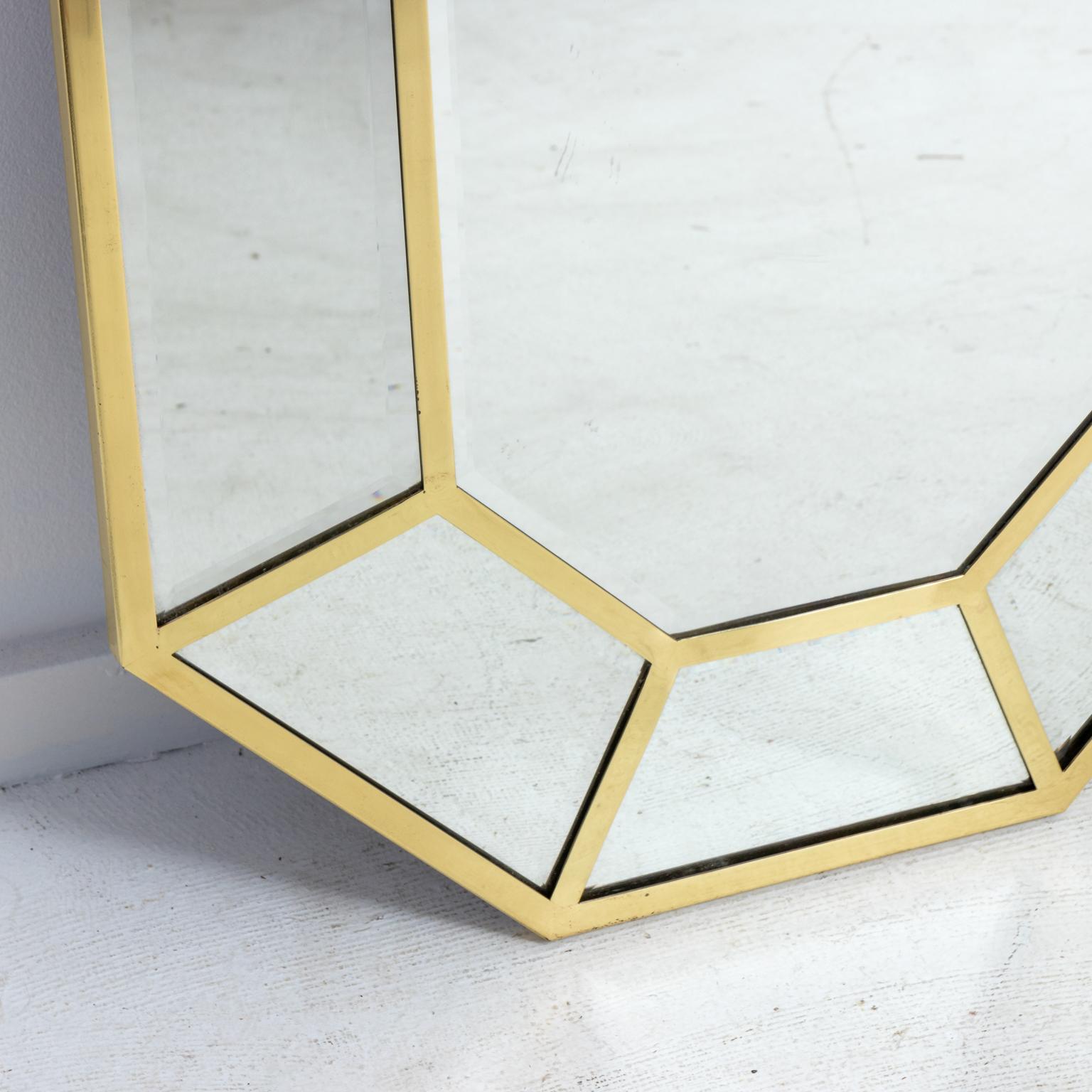 Vintage octagonal faceted brass wall mirror by LaBarge, circa 1970s. Each mirror section features a beveled finish. Made in the United States. Please note of wear consistent with age including patina to metal and minor losses.