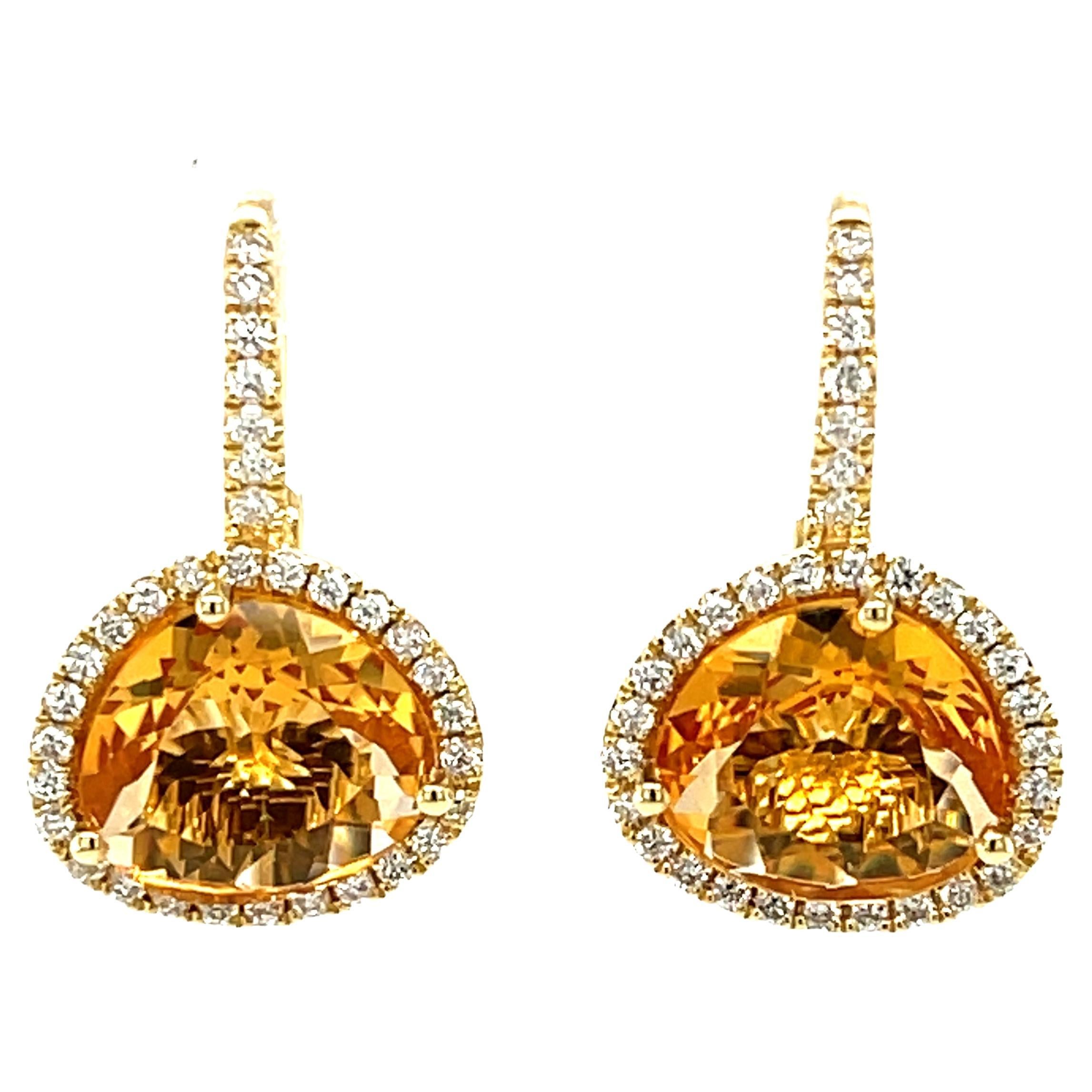 These pretty drop earrings feature crystal clear citrine 