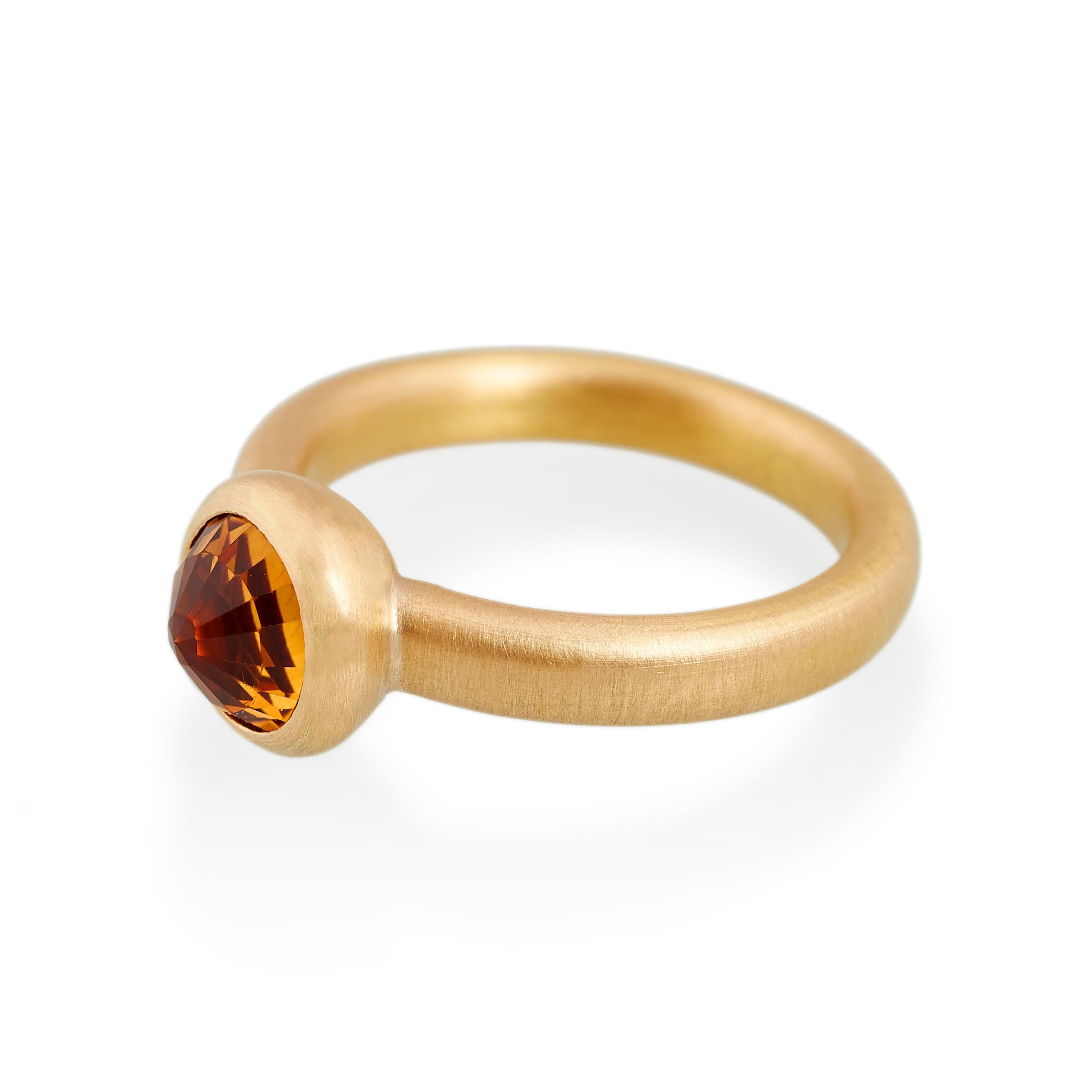 Faceted citrine ring.
Ref: G18001

8mm round citrine
22ct gold

Cadby & Co are a family business that specialise in reusing & up cycling old cut diamonds and fine gem stones. Deborah Cadby’s designs and skills in making are combined with Jeff