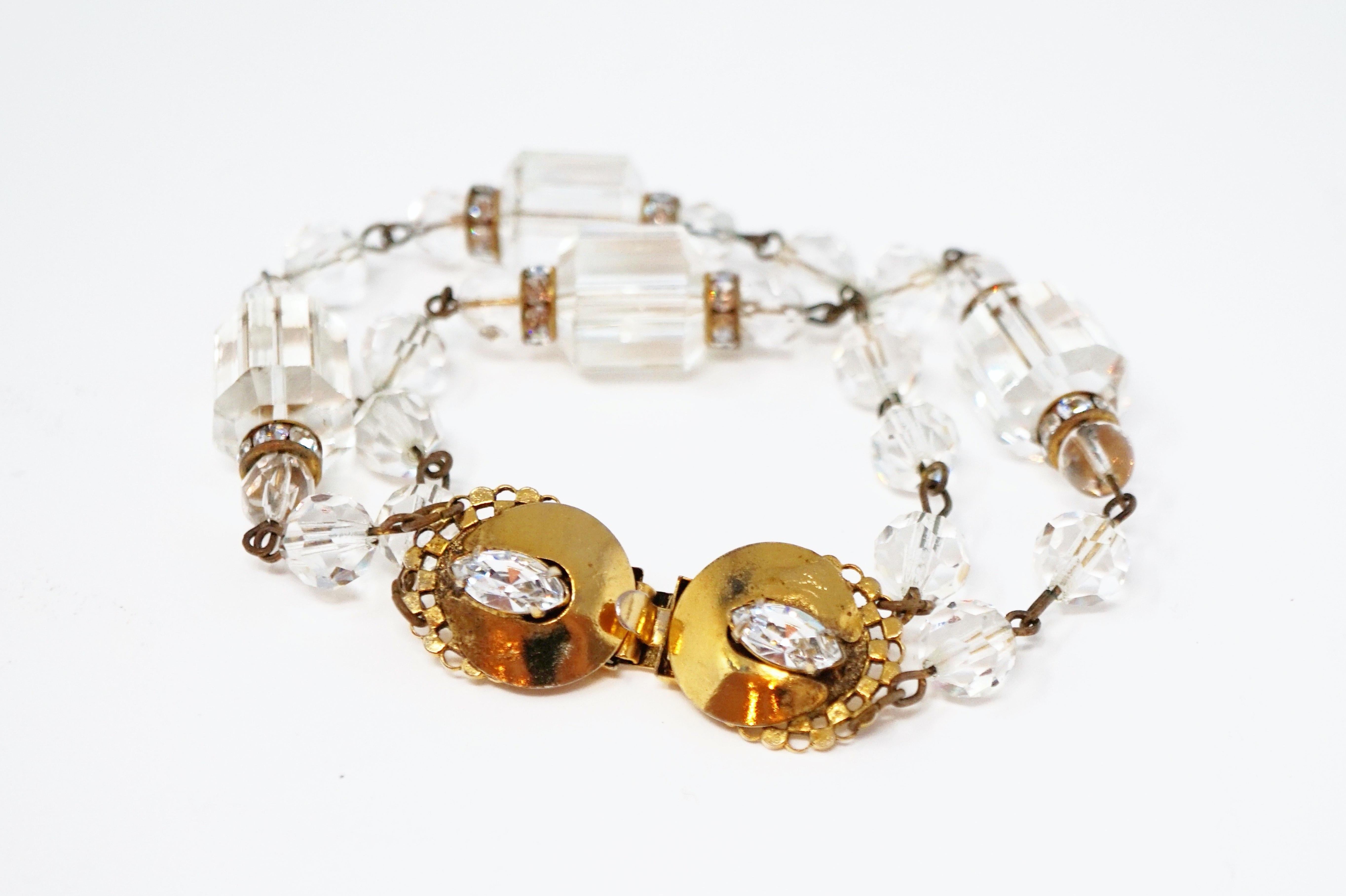Beautiful vintage crystal beaded double strand bracelet by Freirich, circa 1960s.  Composed of faceted barrel cut crystal beads accented with round faceted beads and gold tone hardware.  Two marquise cut crystals accent box clasp hardware. A