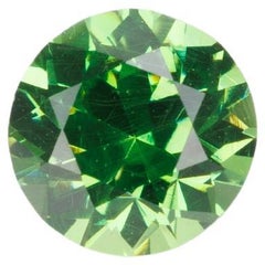 Granato demantoide sfaccettato con buon colore e dispersione, 0,38 ct