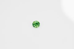 Faceted demantoid garnet with good color and dispersion, 0.46 ct