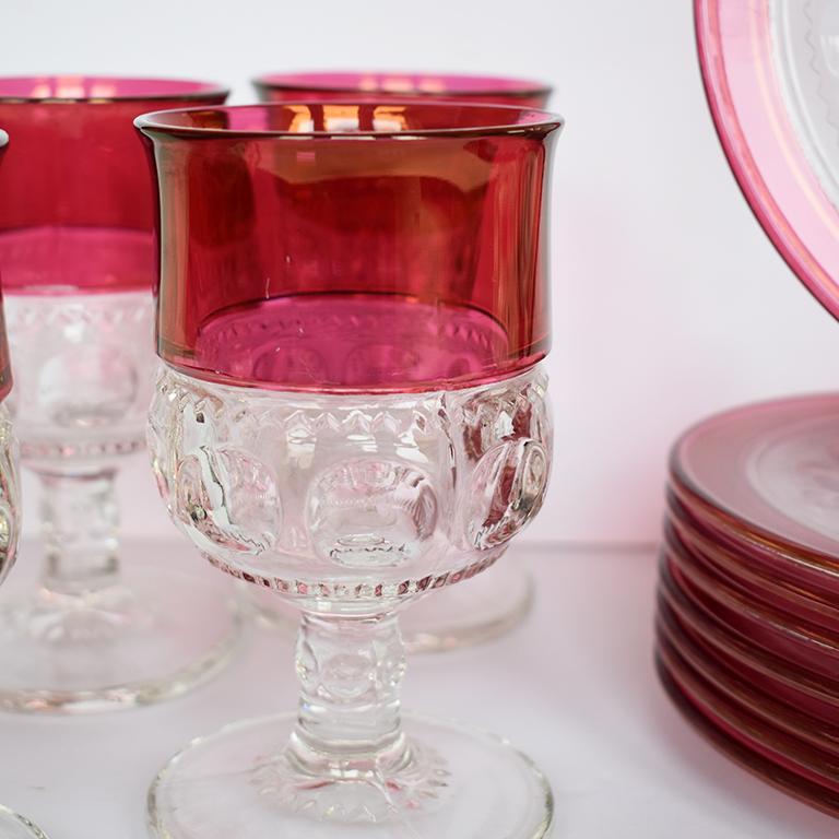 Set of 16 flashed cranberry ruby red Kings Crown dessert plates and glasses from Tiffin-Franciscan Glass. This elegant traditional tableware set includes (8) goblets and (8) dessert plates. 

Plates are round and transparent with clear glass