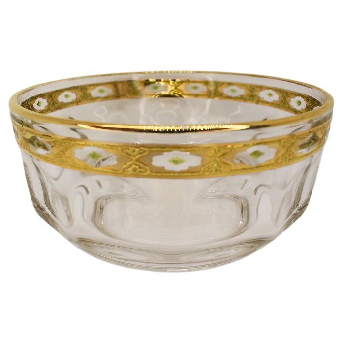 A pair of Art Deco French glass ice cream or trifle bowls. Each bowl is decorated with an Art Nouveau design in gold and green. The sides of each dish are faceted and the bottom is marked with Arcoroc France. 

Dimensions:
4.5