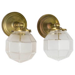 Faceted Frosted Glass Deco Sconces with Brass Arms
Pair
Faceted Frosted Glass Deco Sconces with Brass Arms
Pair