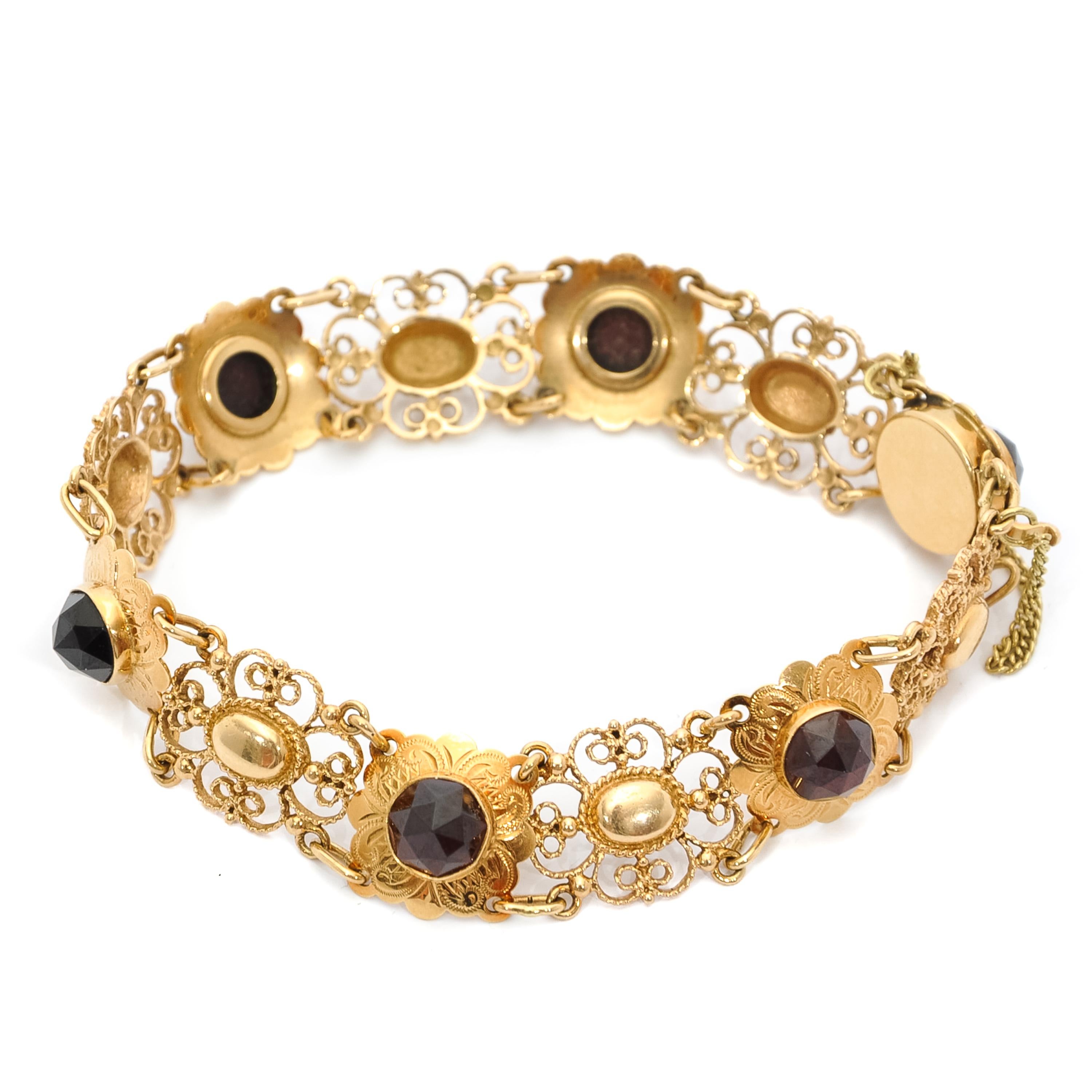 gold bracelet with garnets