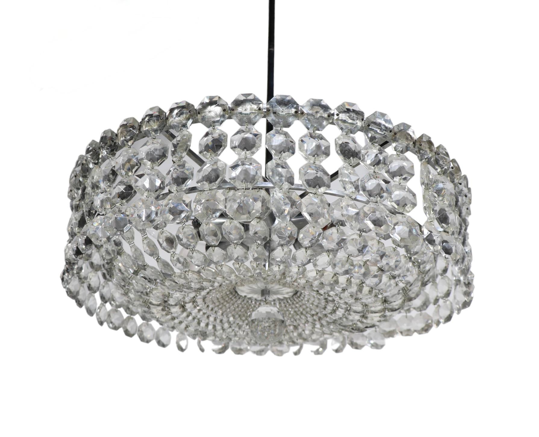 Glamorous Hollywood Regency period hanging fixture by noted American maker, Prescolite, circa 1960-1970's. The chandelier features s beaded basket like bottom surrounded by a ring of faceted glass at the outer edge. The frame is of bright chrome, as