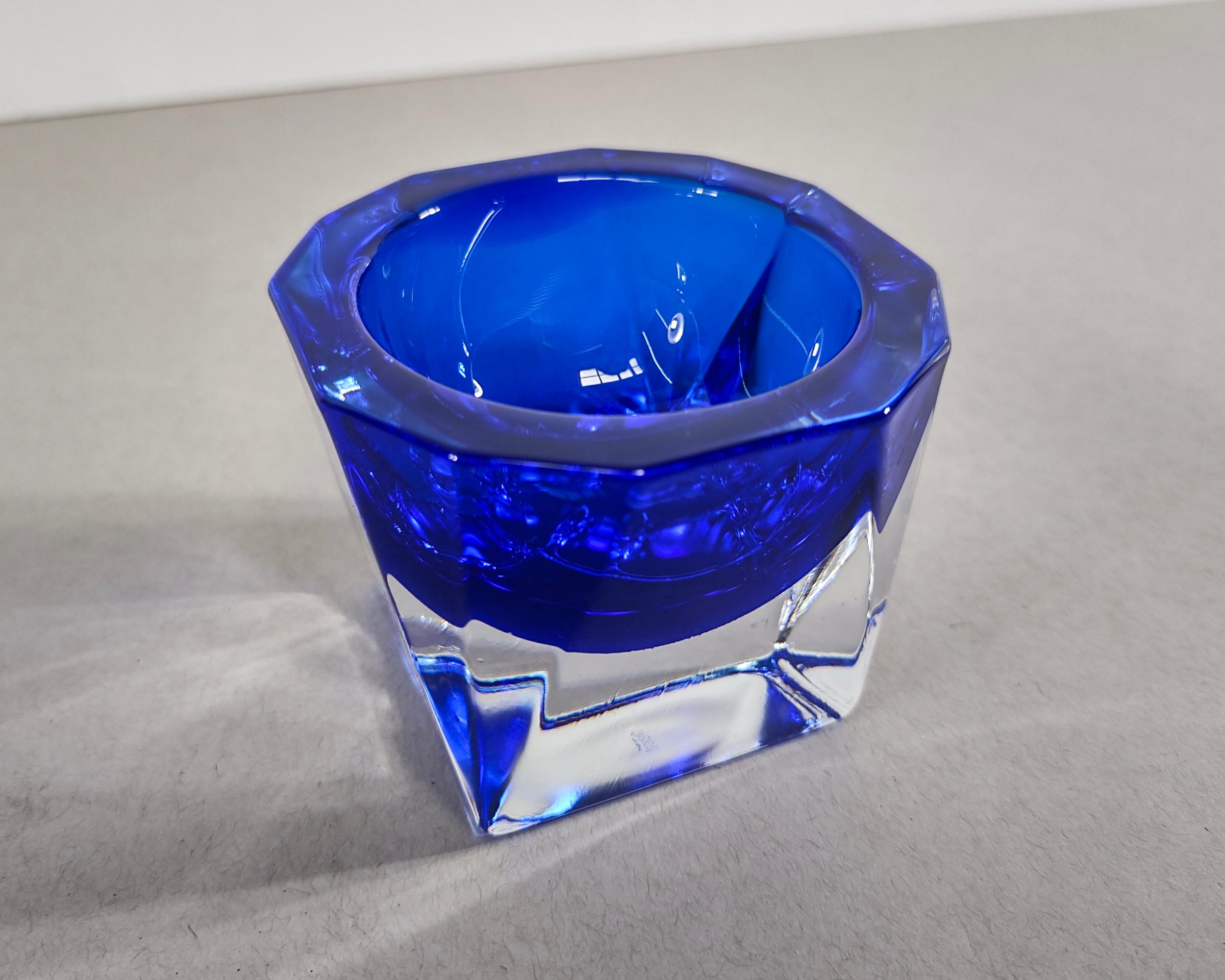 Vintage cobalt blue and thick clear glass candle holder. Faceted corners and thick heavy base. Signed J.G. Durand. Excellent vintage condition.

3.25