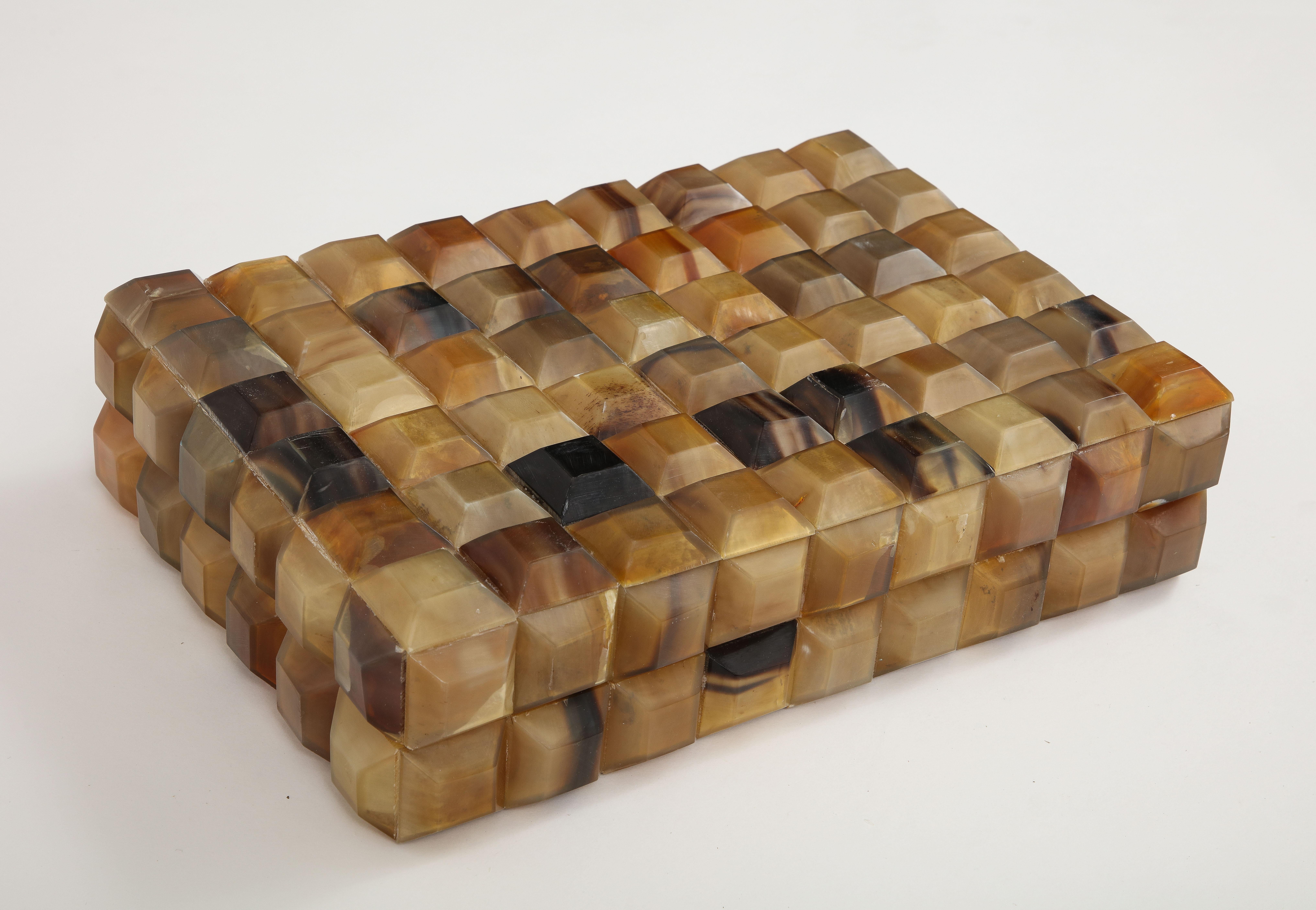 Dimensional keepsake decorative box clad in in square shaped faceted horn elements, lined in wood. A great addition to any coffee table or desk. Measures: 14x10.