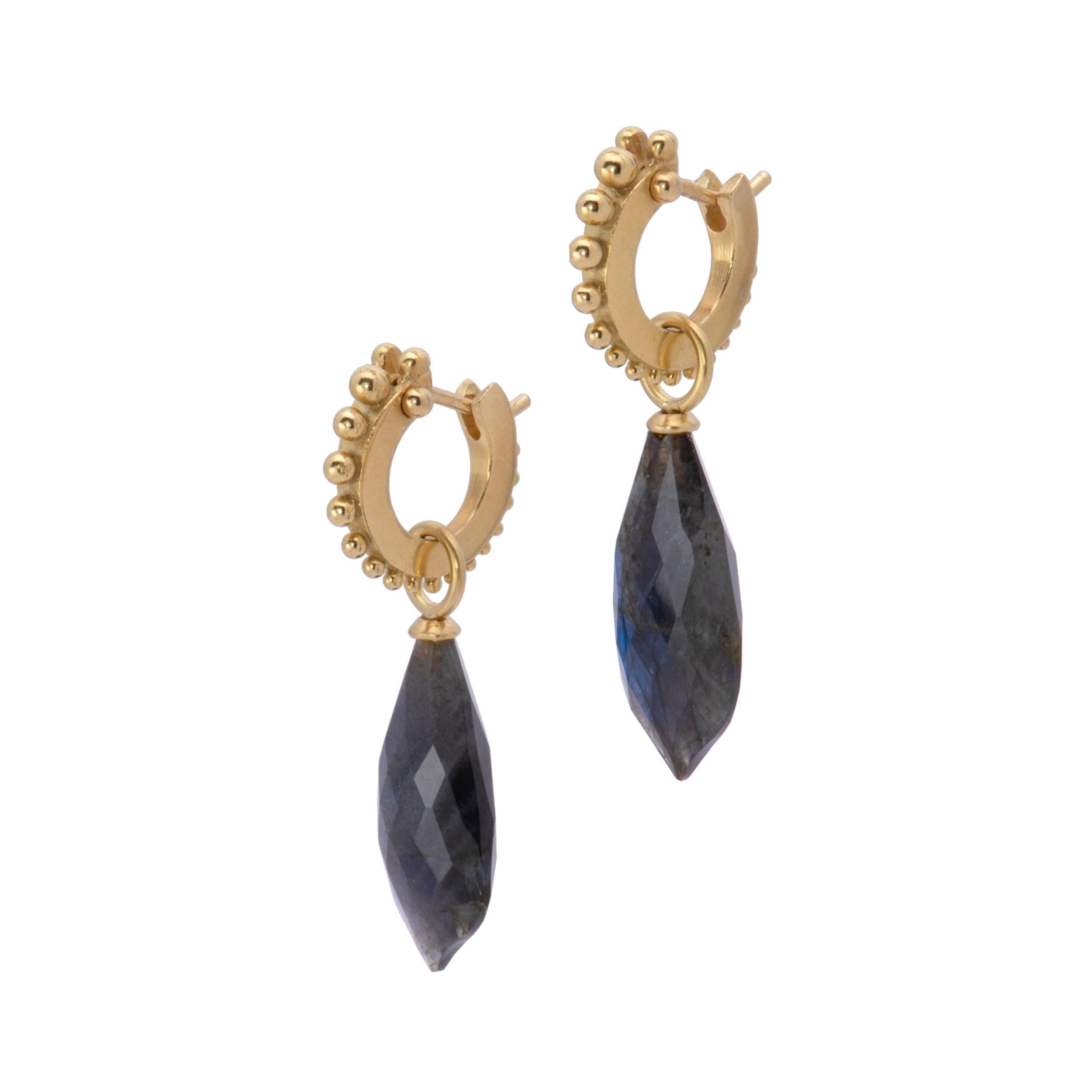 Blue-violet flashes are the story in our Faceted Labradorite Briolette Drop Earrings in 18k gold. Hand crafted in our studio with our signature satin finish, faceted labradorite briolettes taper to a point and are capped with 18k gold bails. Hung