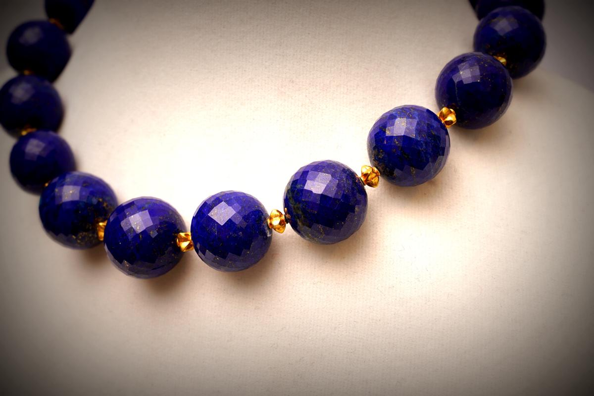 Fine, natural and faceted lapis lazuli bead necklace.  Beautiful peacock blue color and very unusual to find faceted.  Set with 22K gold beads between.  Slightly graduated.  Toggle clasp.  By Deborah Lockhart Phillips.