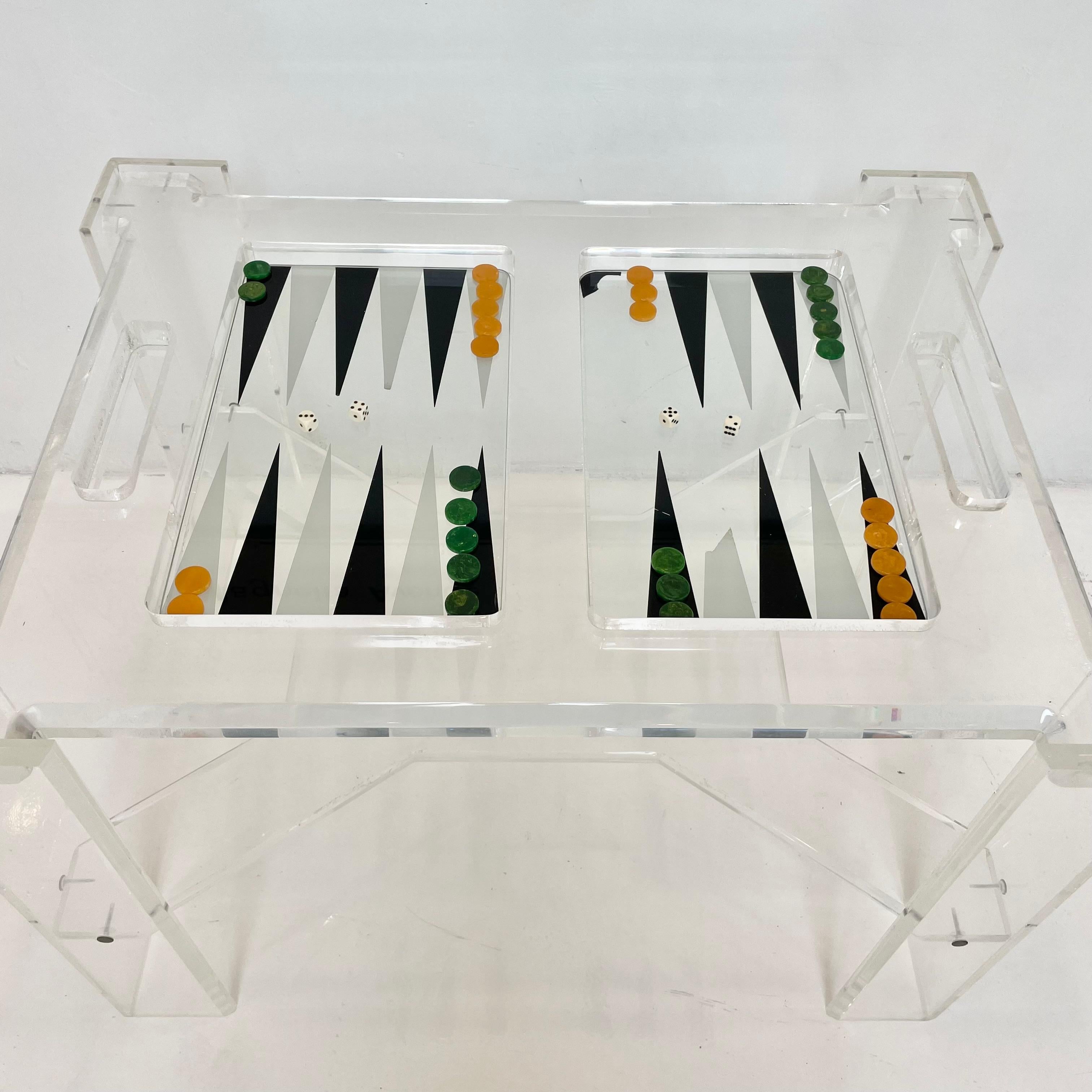 Faceted Lucite backgammon table with removable glass table top. Entire table is a thick clear Lucite giving this piece a great open feel and minimal look. Lucite is in good condition with some scratches and wear as shown. Extremely heavy. Unusual