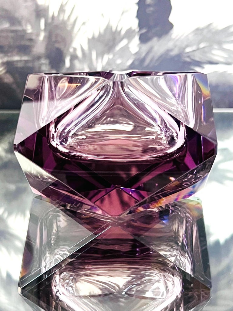 Mid-Century Modern Murano glass ashtray or decorative bowl in purple amethyst glass with exquisite faceted design. The diamond shaped bowl has a prism effect capturing and reflecting light from every angle. The glass rim features four polished