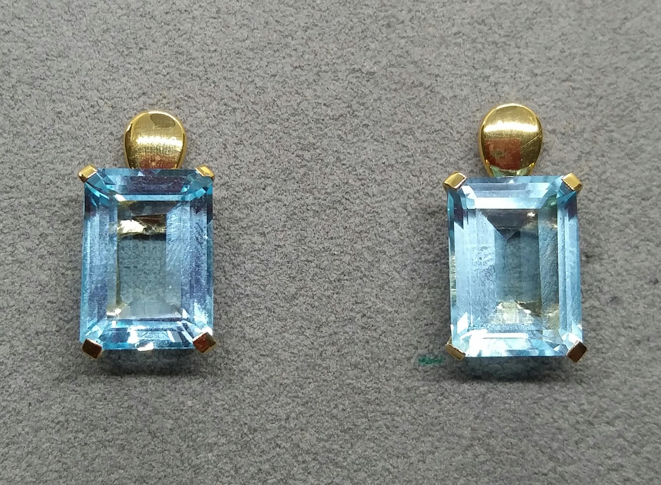 
Classic and simple chic stud earrings,totally handmade in 14 kt yellow gold setting a nice and clean Octagon Shape Blue Topaz ,measuring 10 x 14 millimeters.

 In 1978 our workshop started in Italy to make simple-chic Art Deco style jewellery,