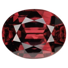 Faceted oval red zircon, 7.08 cts