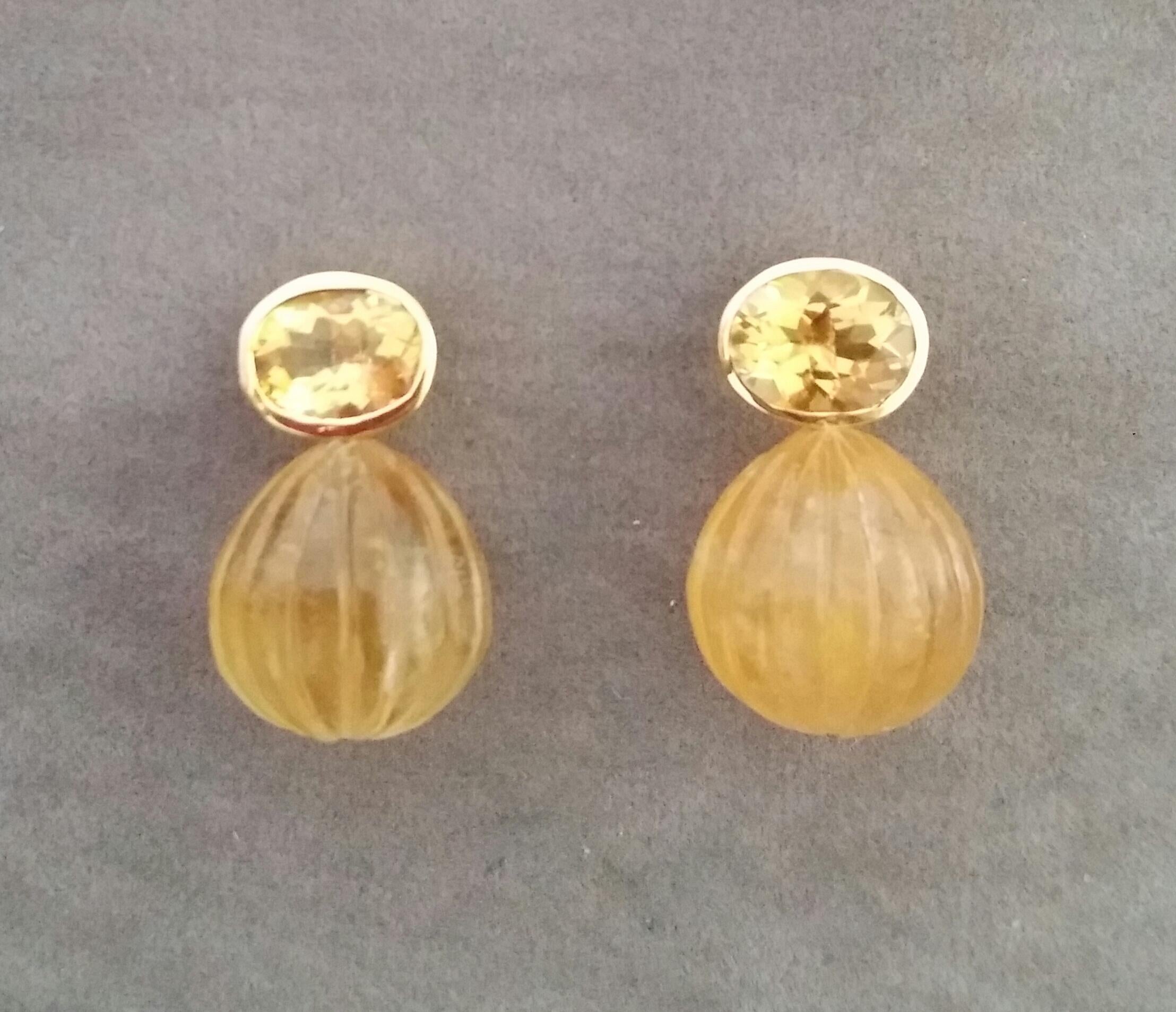 These simple but elegant and completely handmade earrings have 2 Oval Shape Faceted  Natural Citrines measuring 9 x 11 mm set in yellow gold bezel at the top to which are suspended 2  Engraved Citrine Round Drops measuring 15x15 mm.

In 1978 our