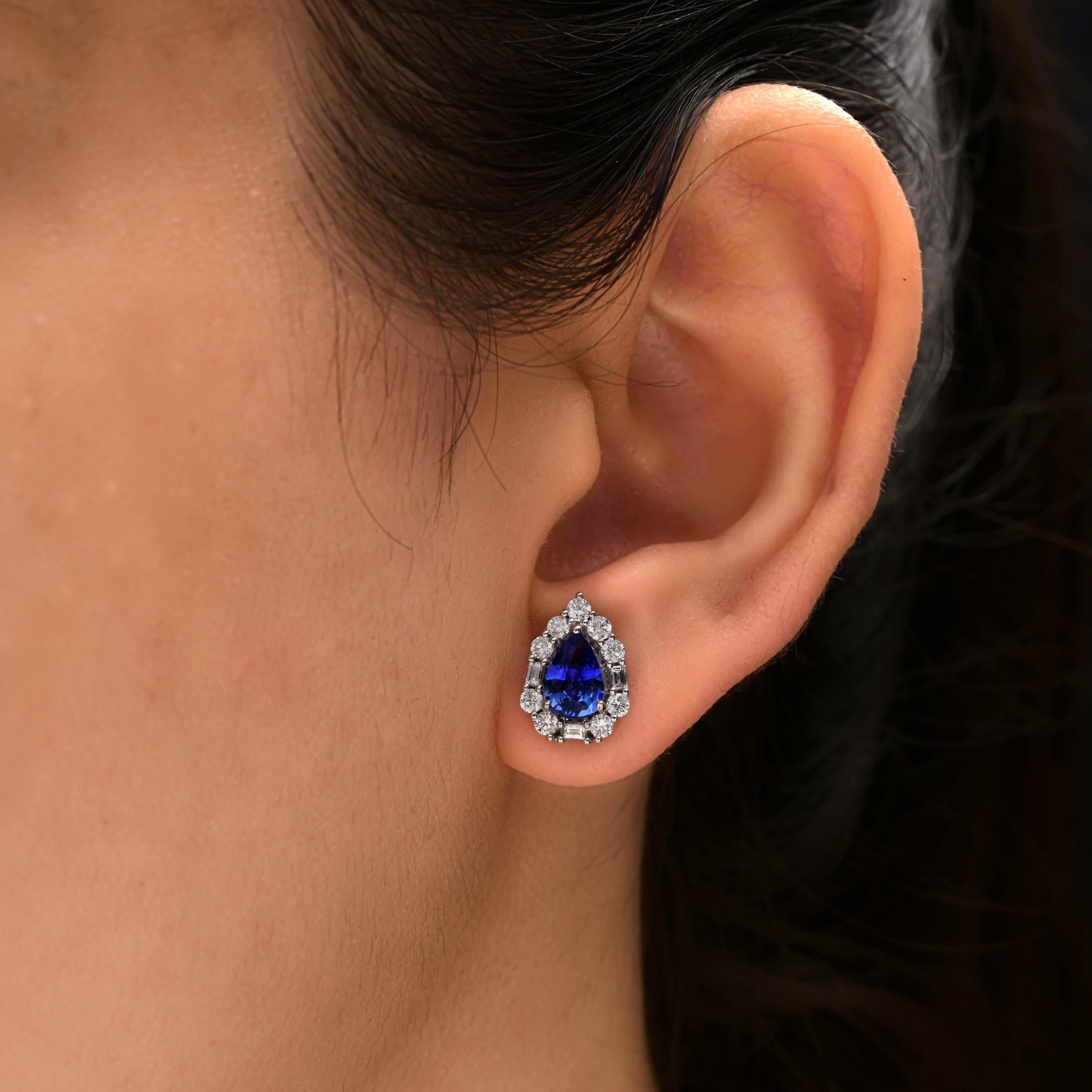 Cast from 18-karat gold, these exquisite earrings are handset with 1.67 carats of blue sapphire and 0.69 carats of sparkling diamonds. Blue Sapphire is a September birthstone and is believed to enhance mental clarity and communication skills. A