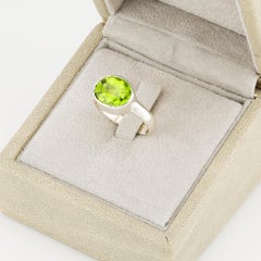 Faceted peridot cabochon silver ring
