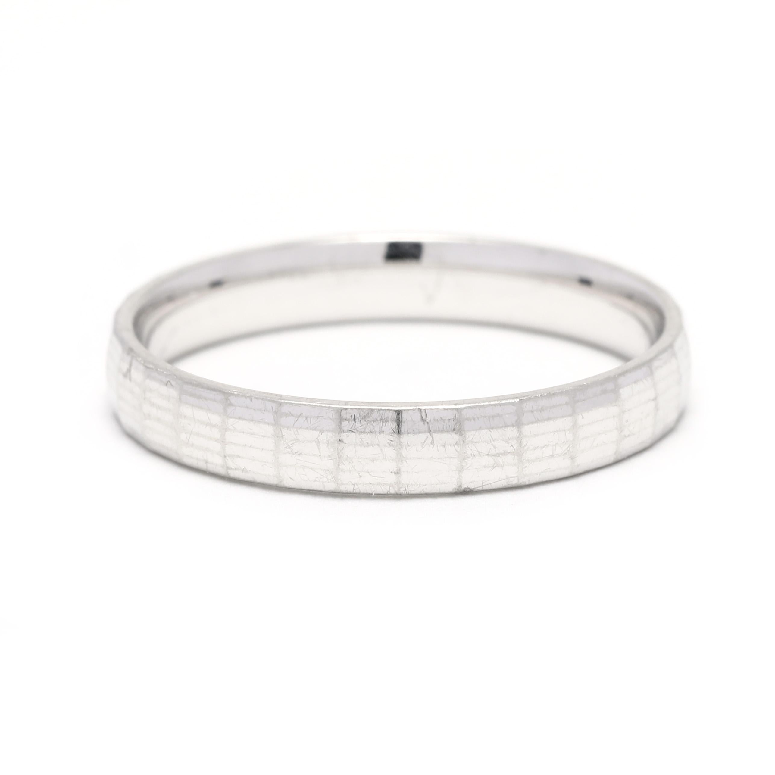This classic faceted platinum wedding band is perfect for any occasion. Crafted from solid platinum, the timeless ring features a 3mm wide band and is size 6.25. Wear it alone for a simple, elegant look or style it with other stackable bands for a