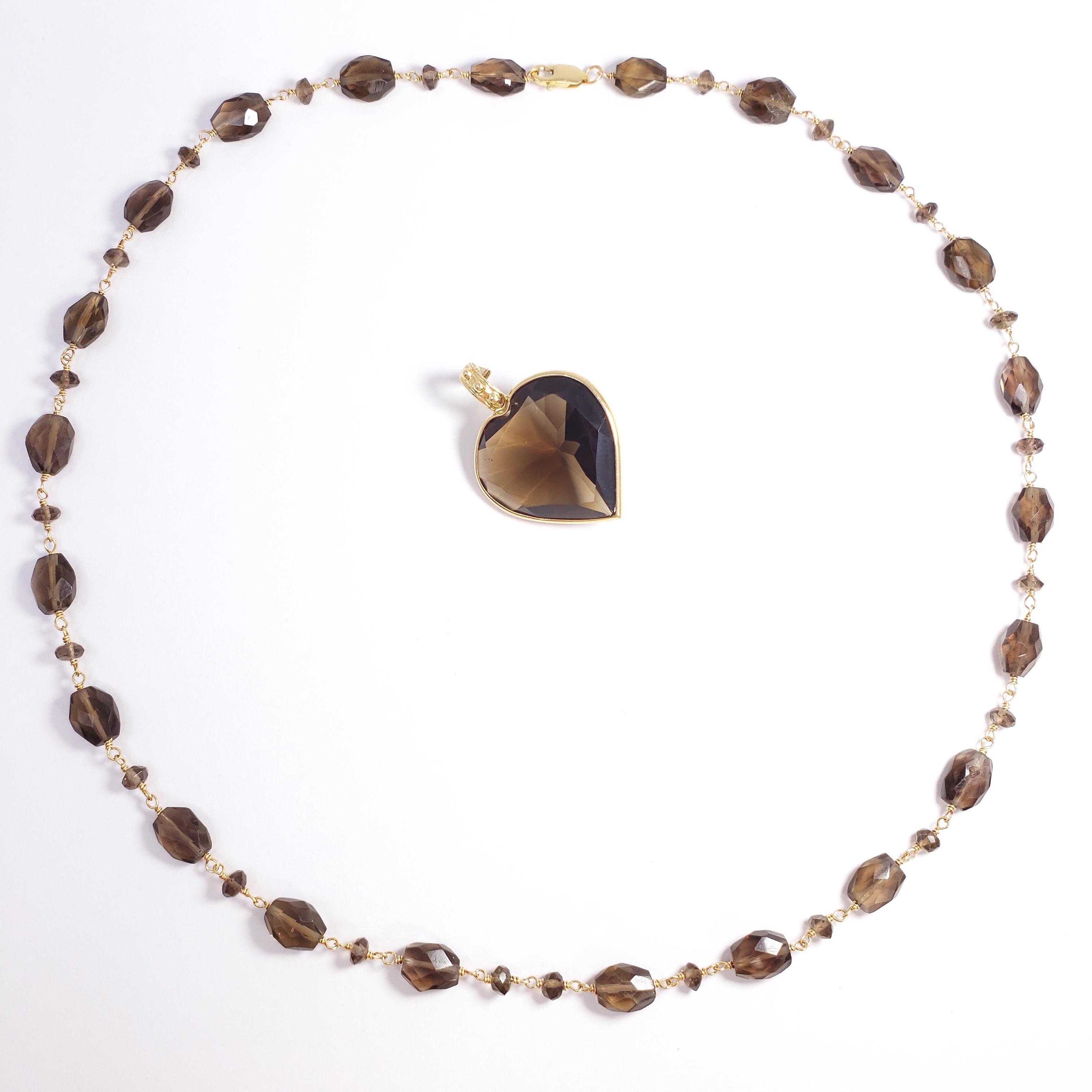 An elegant removeable pendant necklace, featuring a faceted quartz heart pendant on a 14K yellow gold chain, accented with faceted smoky brown quartz beads. A stylish piece!

Hallmarks: 14K, 1BB

Necklace length - 50.5cm
Pendant dimensions - 2.7cm x