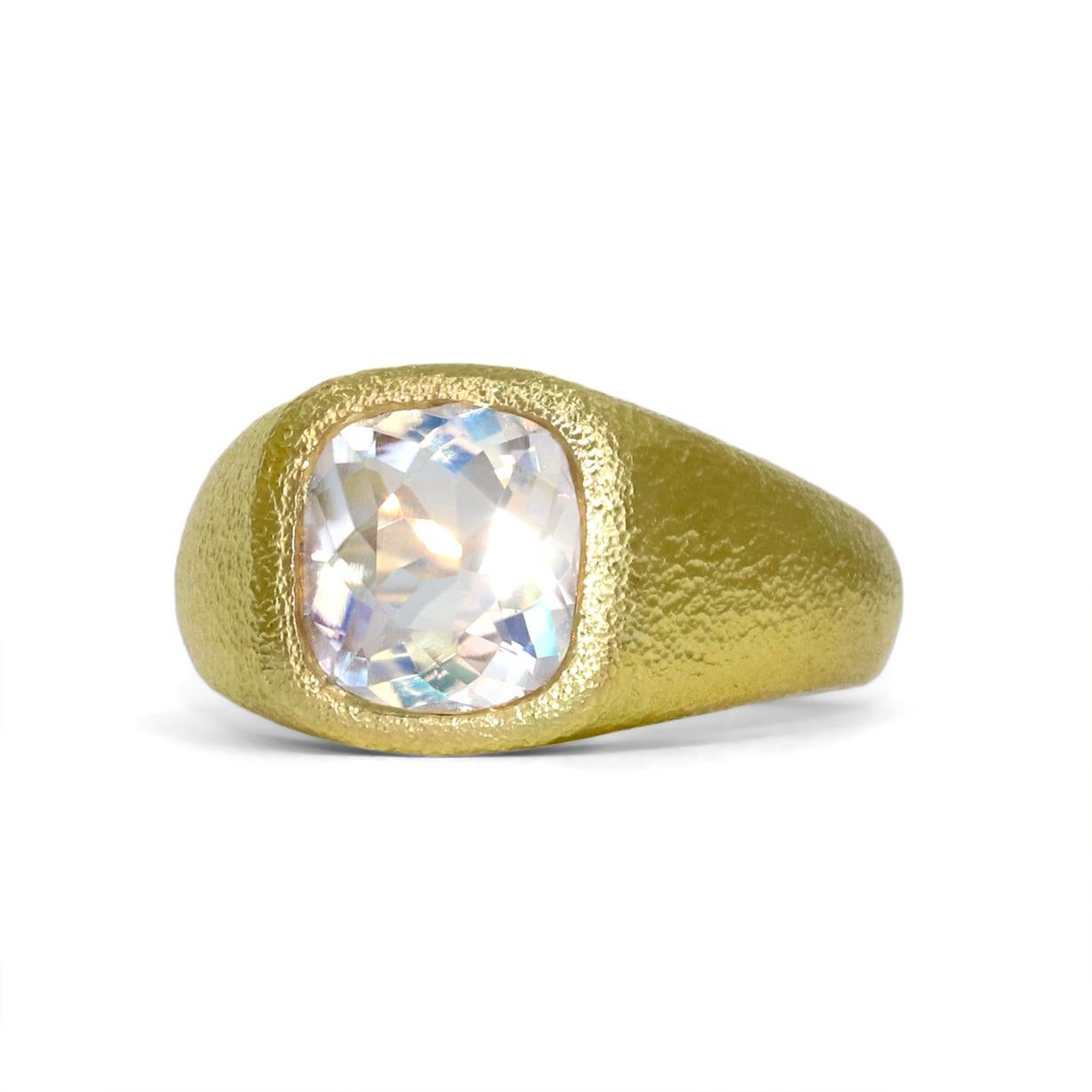 One of a Kind Ring handcrafted by acclaimed jewelry maker Devta Doolan in the artist's signature finished 18k yellow gold showcasing a magical faceted rainbow moonstone with primary blue/violet adularescence complemented with rainbow flash and