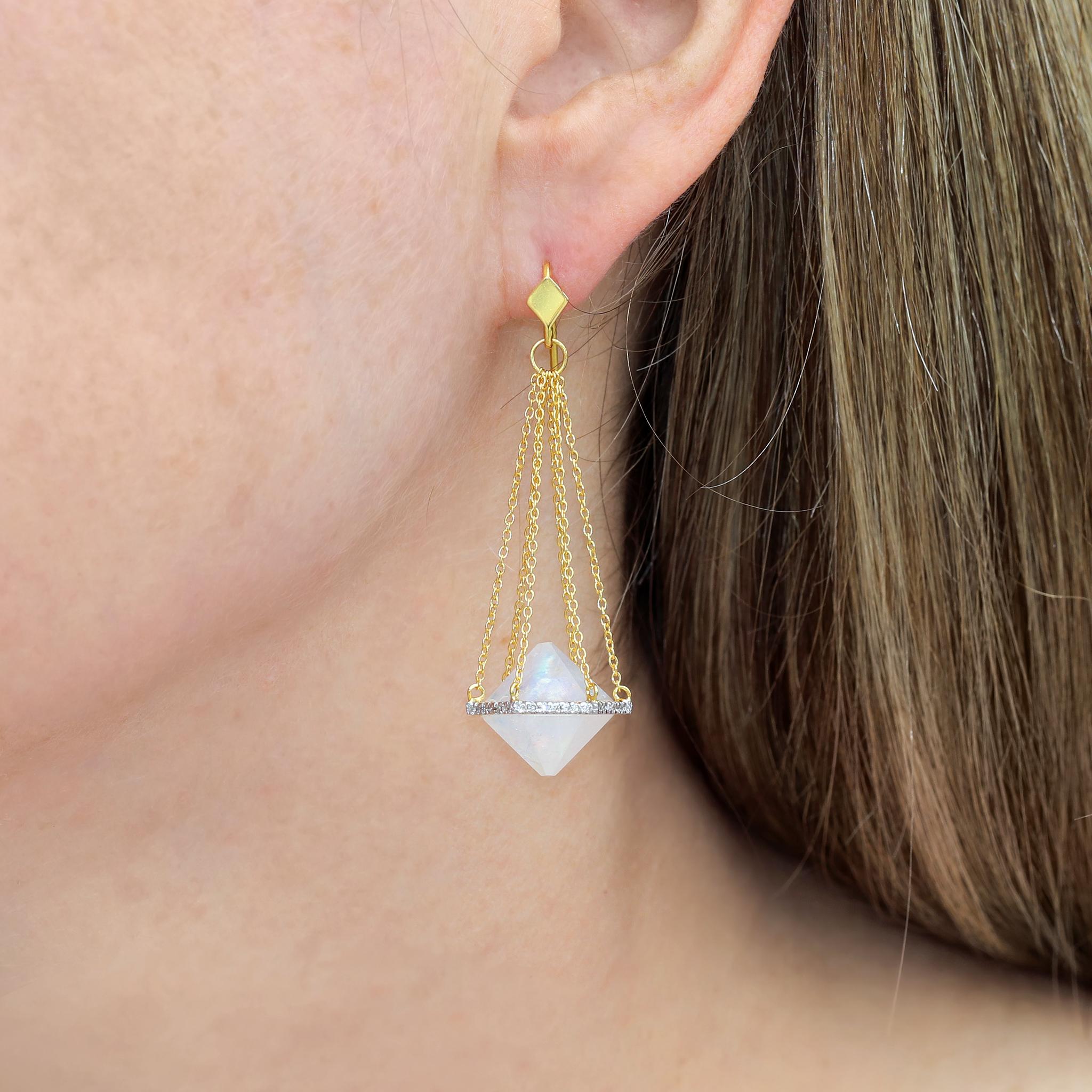 One of a Kind Balance Earrings by jewelry artist Lauren Harper hand-fabricated in 18k yellow gold featuring a matched pair of custom-cut and faceted hexagonal rainbow moonstones uniquely flush-set in hexagonal 18k white gold elements set with round