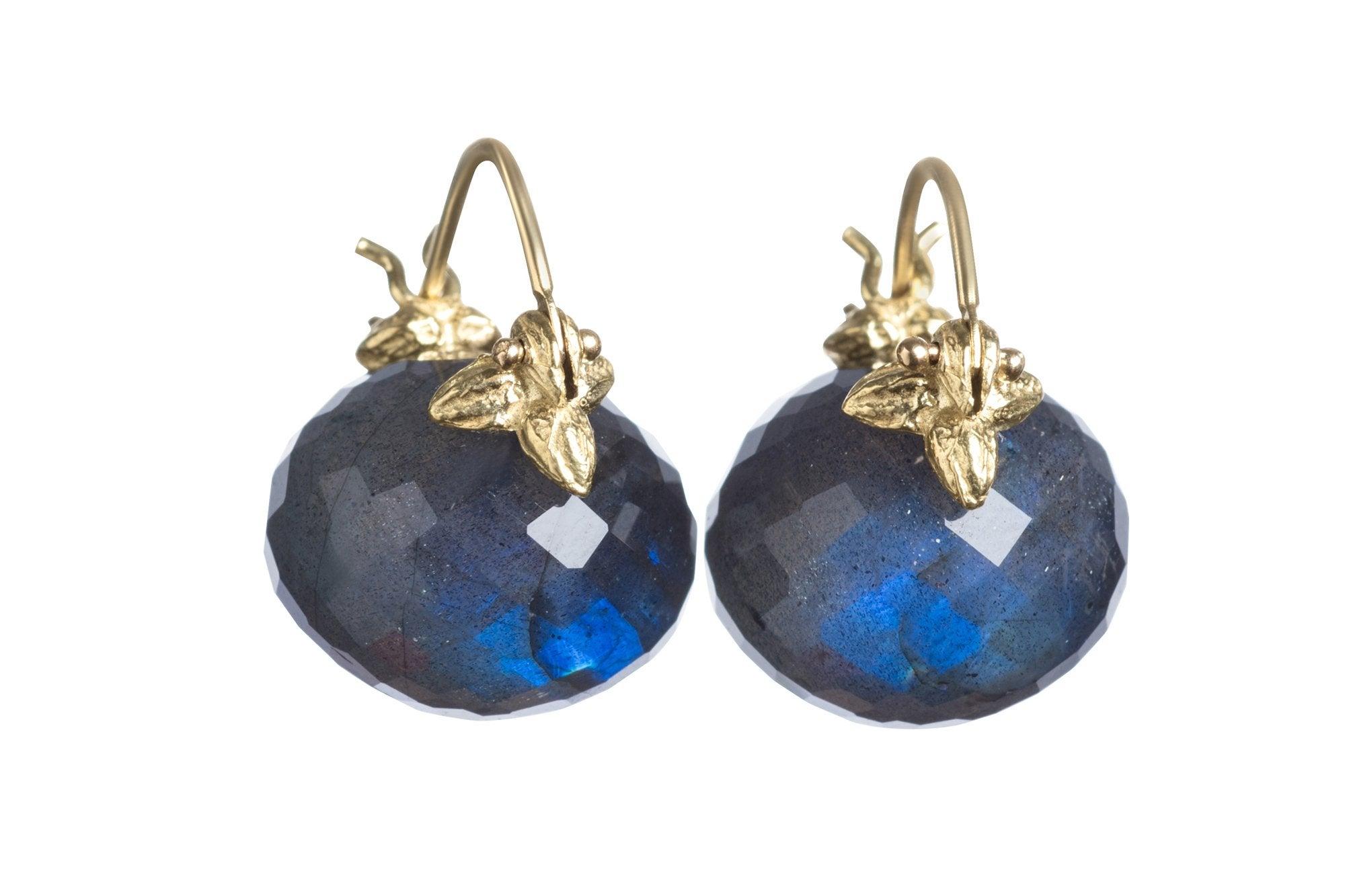 The finest blue flash emanates from these fabulously plump faceted labradorite rondelles. When refracted light isn't turning the gems into blue fire, labradorite is a sophisticated shade of deep taupe-gray. The combination of reserve and dazzle is