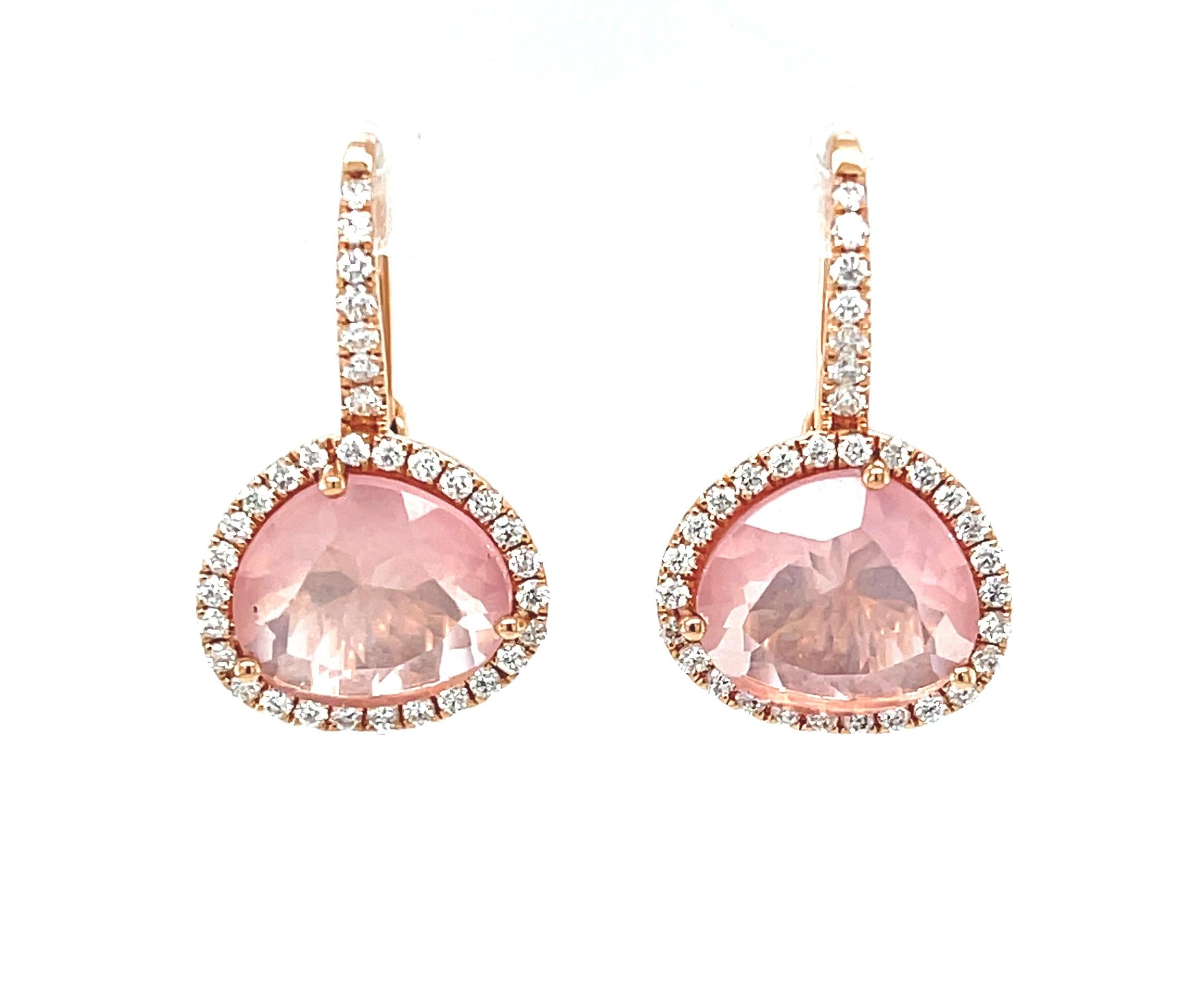 These pretty drop earrings feature faceted rose quartz crystals set in 18k rose gold with sparkling diamond set frames! The rose quartz are a unique 