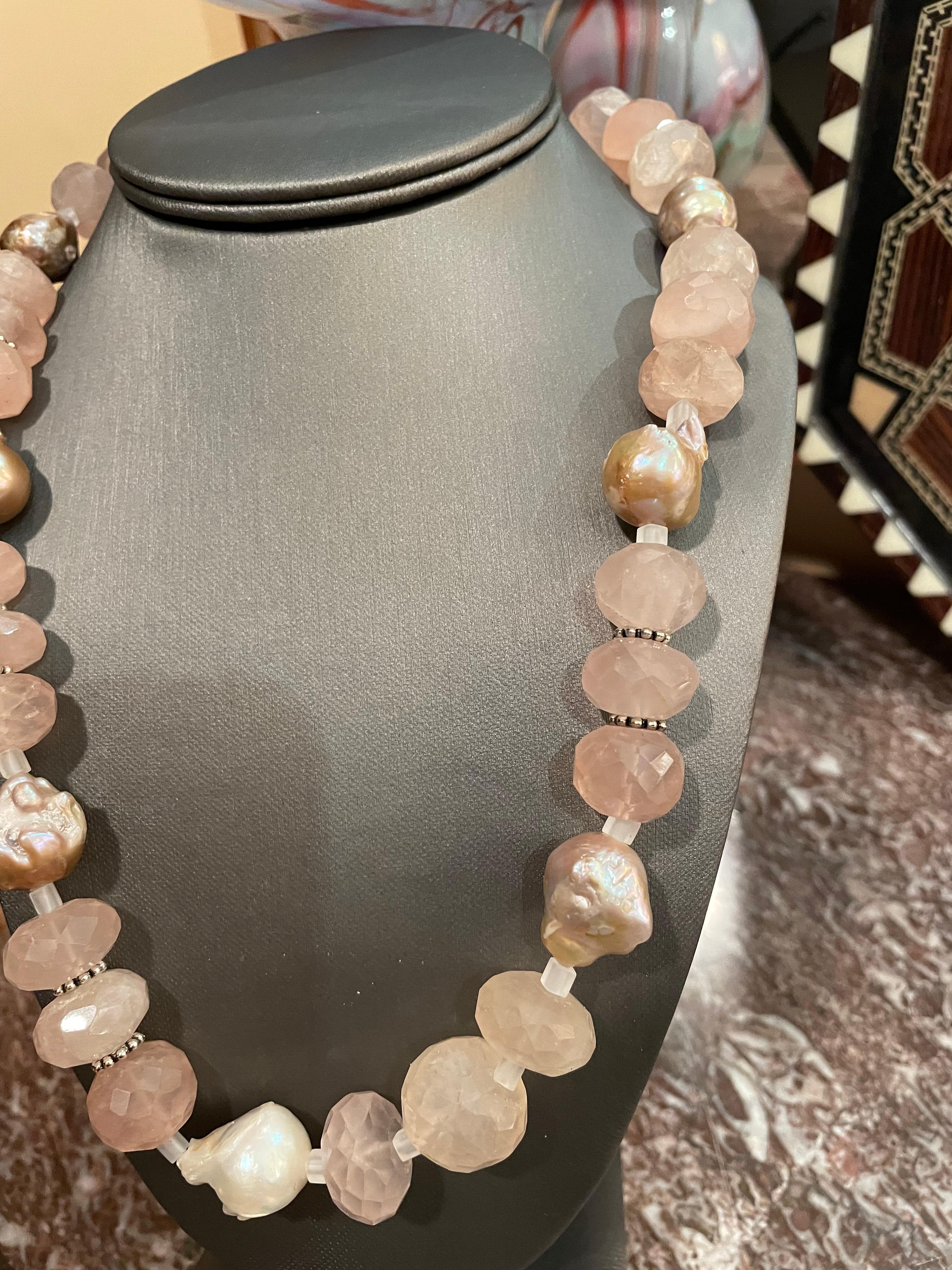 Large faceted rose quartz beads and pink baroque pearls in a gorgeous necklace from Lorraine’s Bijoux is on offer. Sterling silver spacers enhance the fabulous rose quartz beads.A chunky and luxurious piece that would enhance any look.