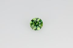 Faceted russian demantoid garnet 0.6 ct